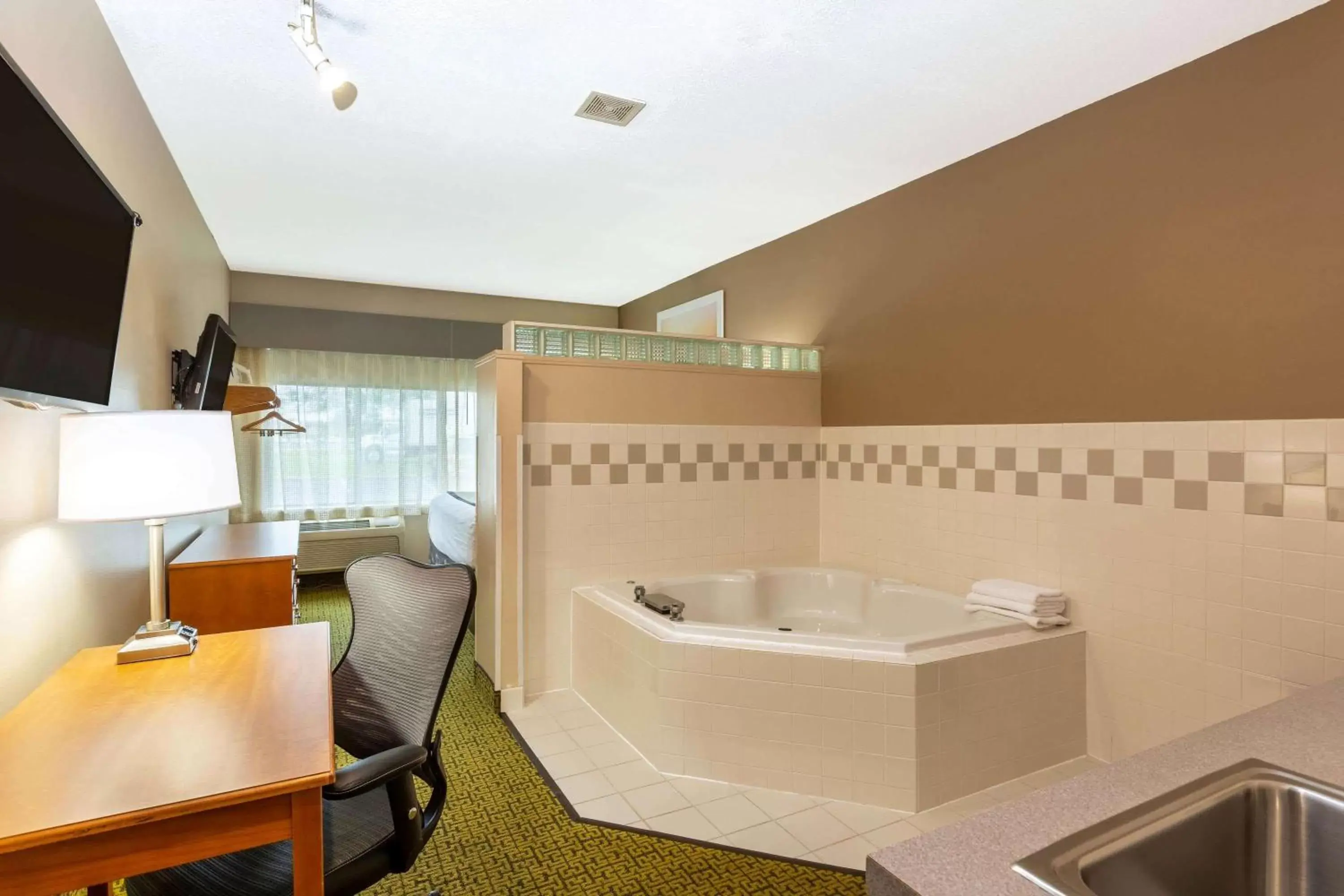 Photo of the whole room, Bathroom in Days Inn & Suites by Wyndham Madison