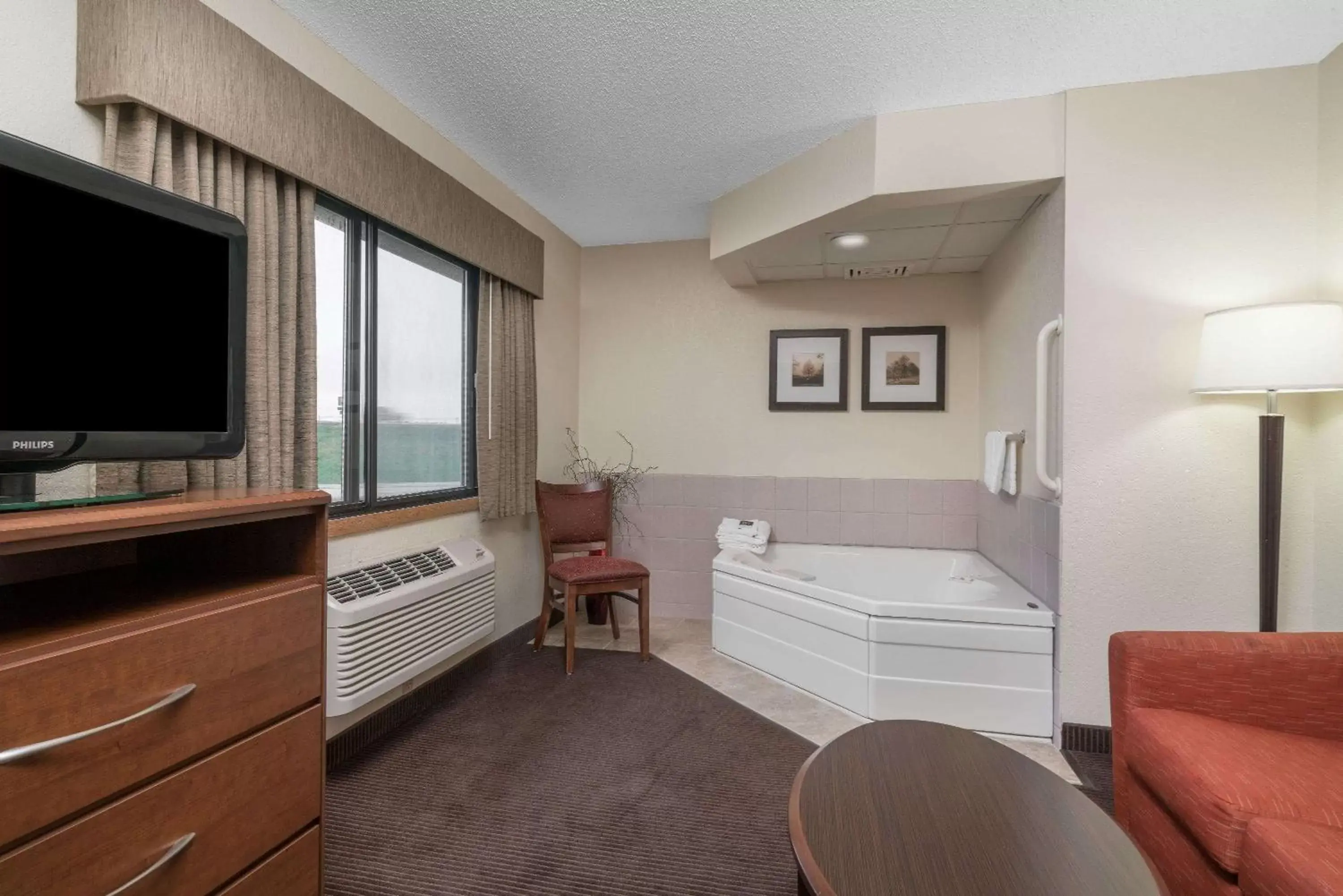 Photo of the whole room, TV/Entertainment Center in AmericInn by Wyndham Worthington