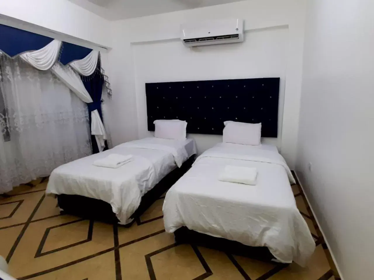 Bed in Al Rayyan Hotel Apartments Muscat