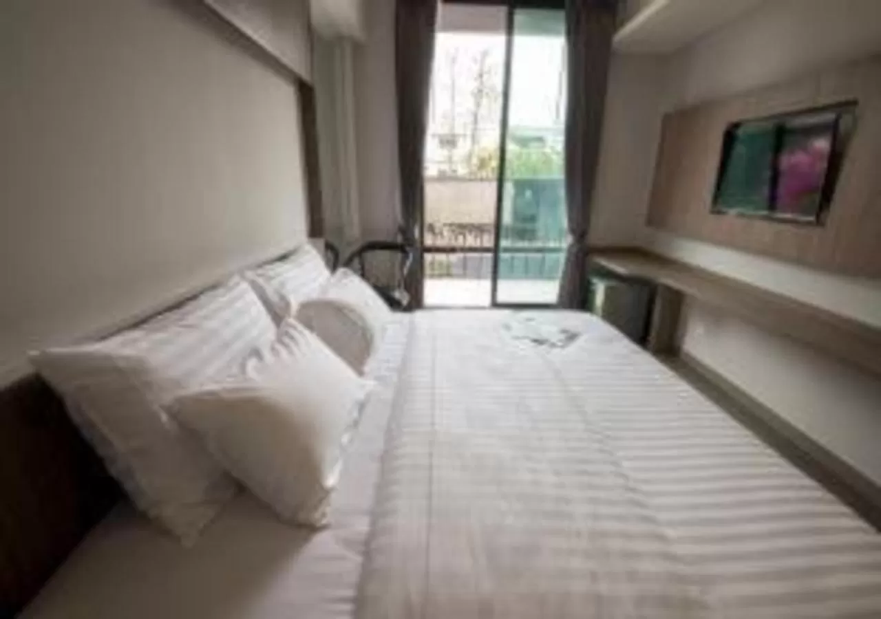 Bed in V20 Boutique Jacuzzi Hotel