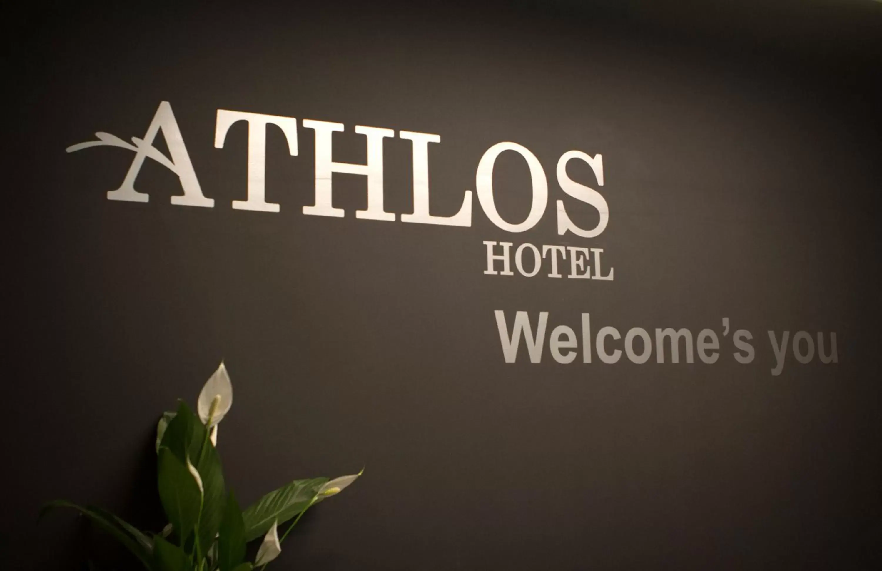 Property Logo/Sign in Athlos Hotel