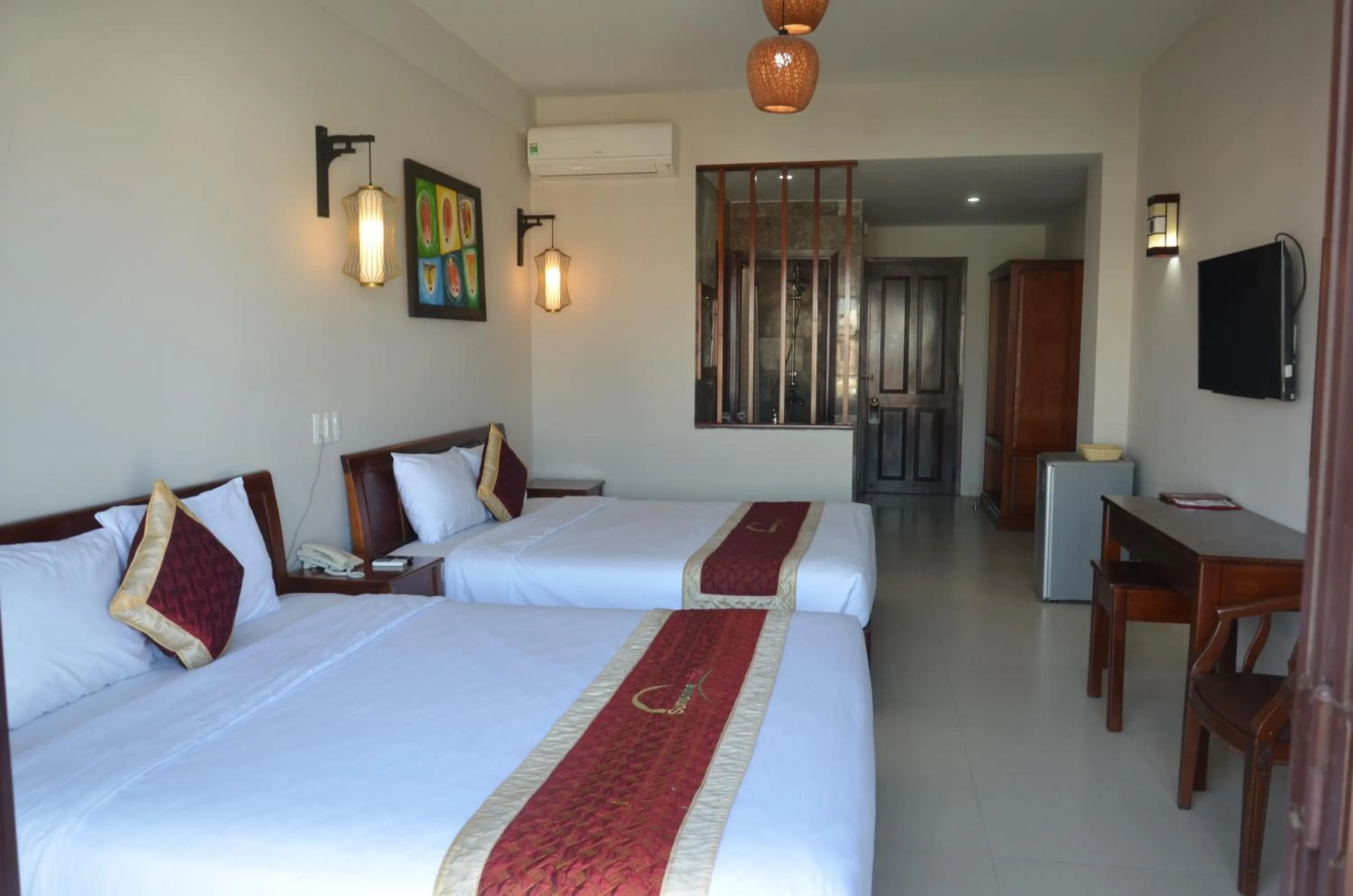 Bed in Sunshine Hoian Hotel