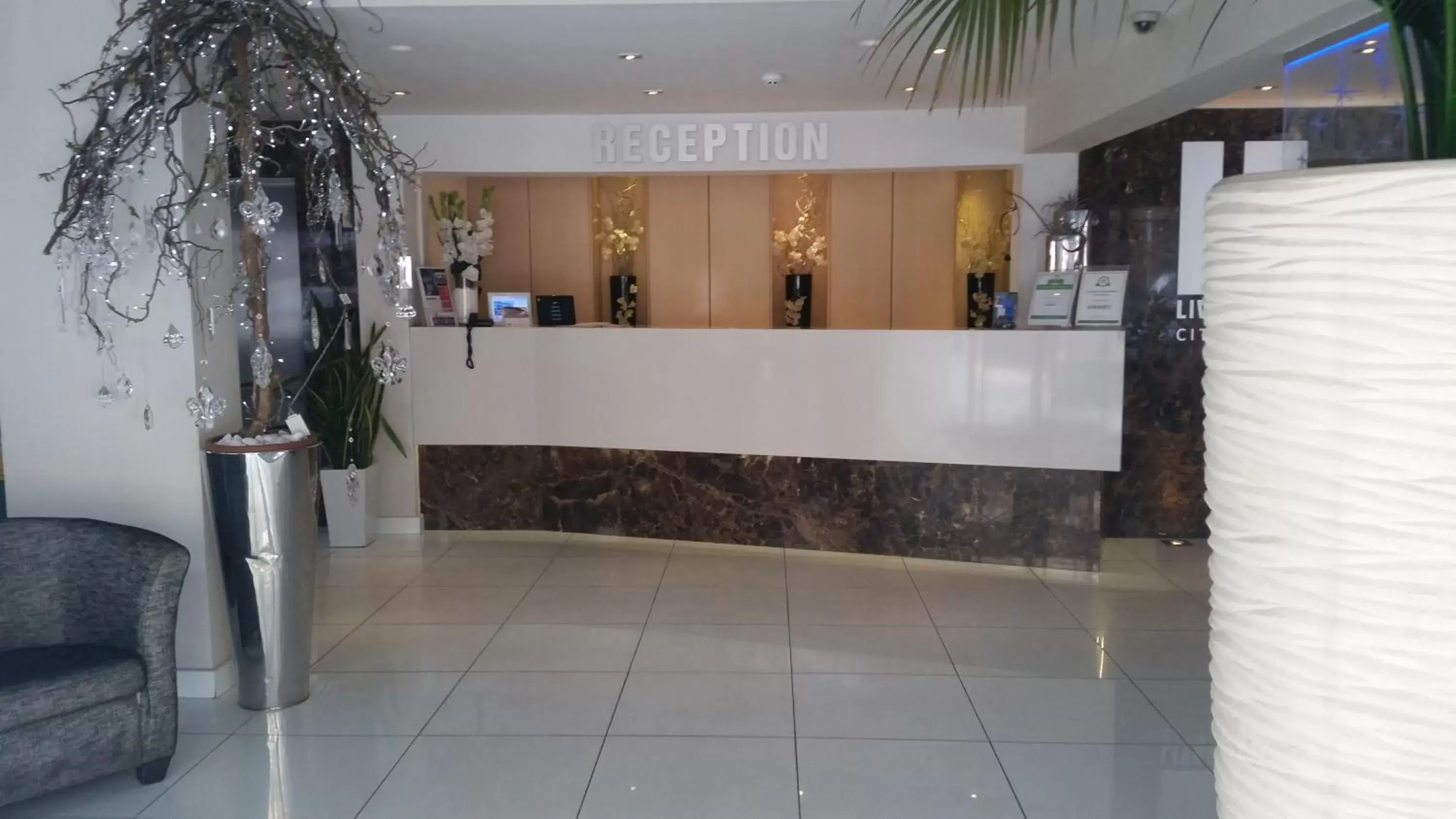 Lobby or reception in Livadhiotis City Hotel Lobby or reception in Livadhiotis City Hotel