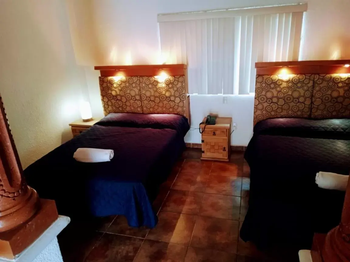 Bedroom, Bed in Hotel Leyenda del Tepozteco