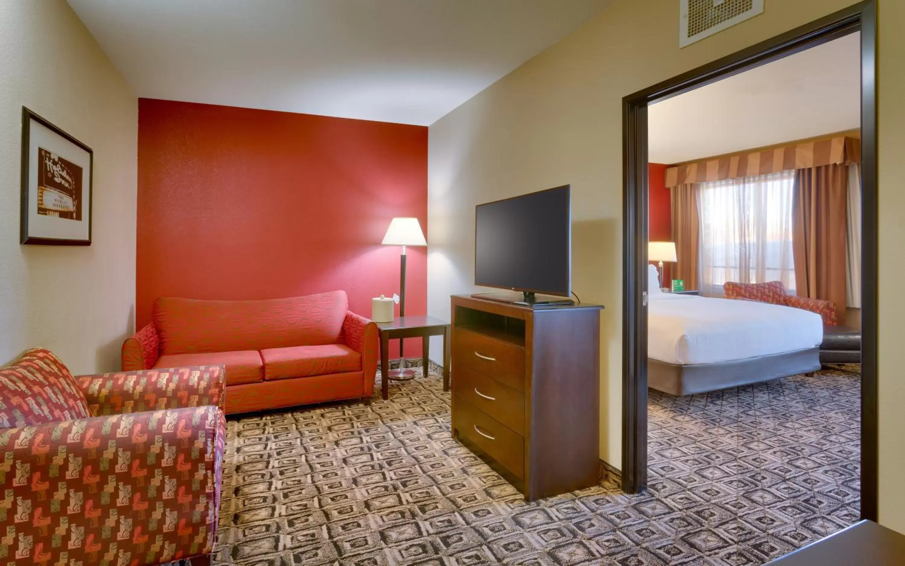 Photo of the whole room, TV/Entertainment Center in Holiday Inn & Suites Salt Lake City - Airport West, an IHG Hotel