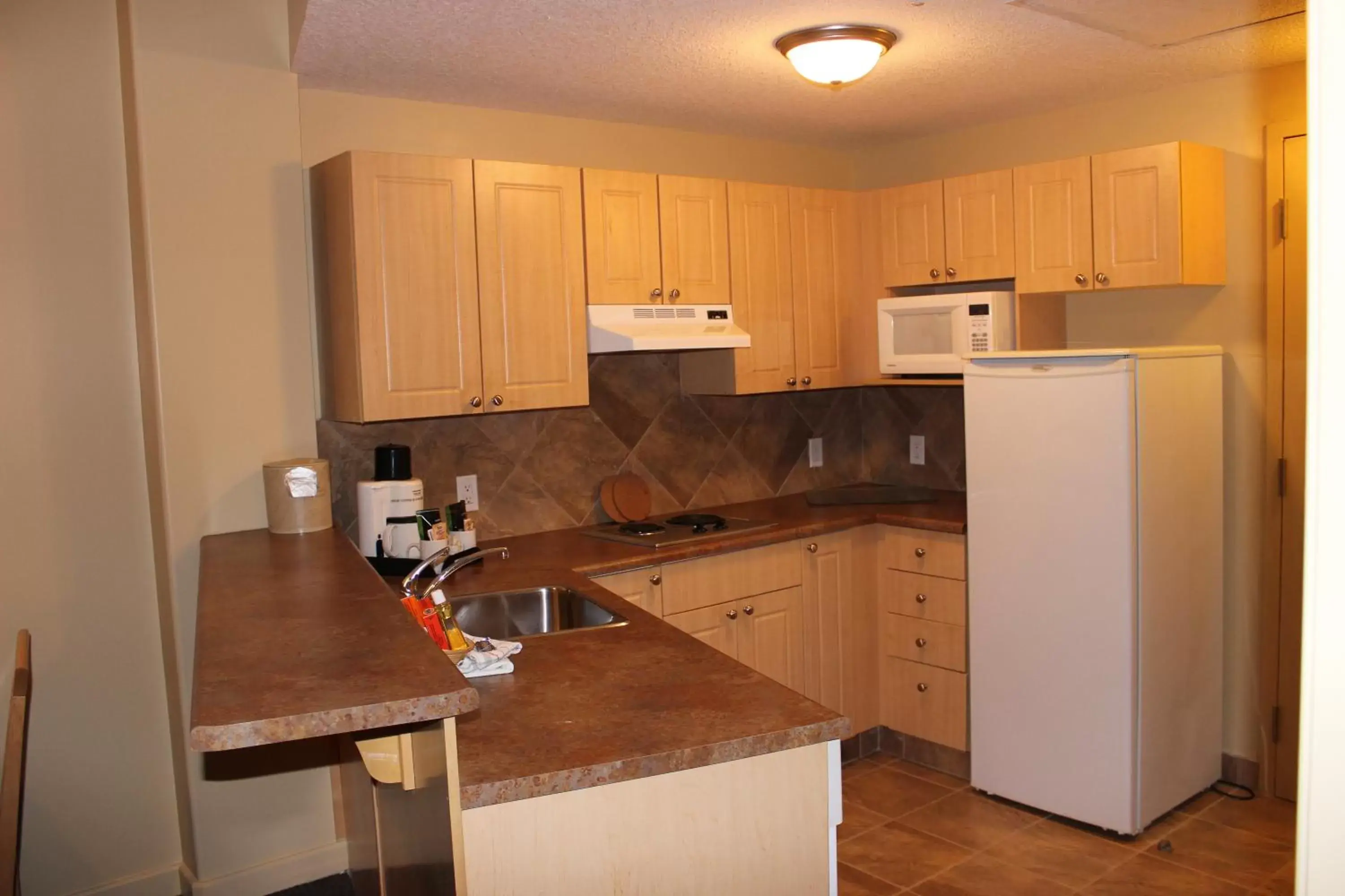 Kitchen or kitchenette, Kitchen/Kitchenette in Clearwater Suite Hotel