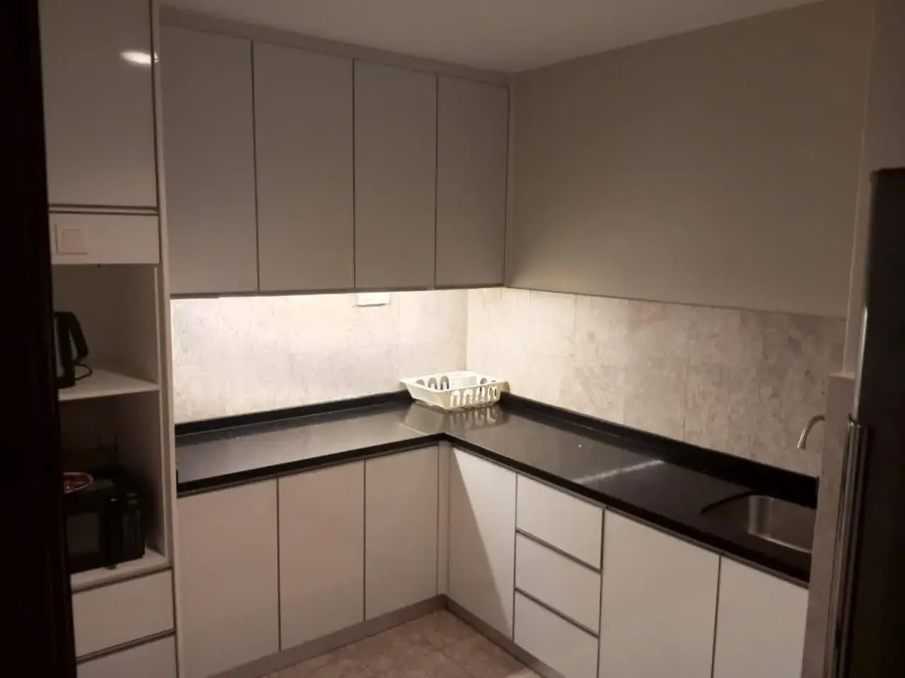 Kitchen/Kitchenette in The Apartments @ Times Square