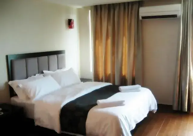 Bed in Kk Waterfront Hotel