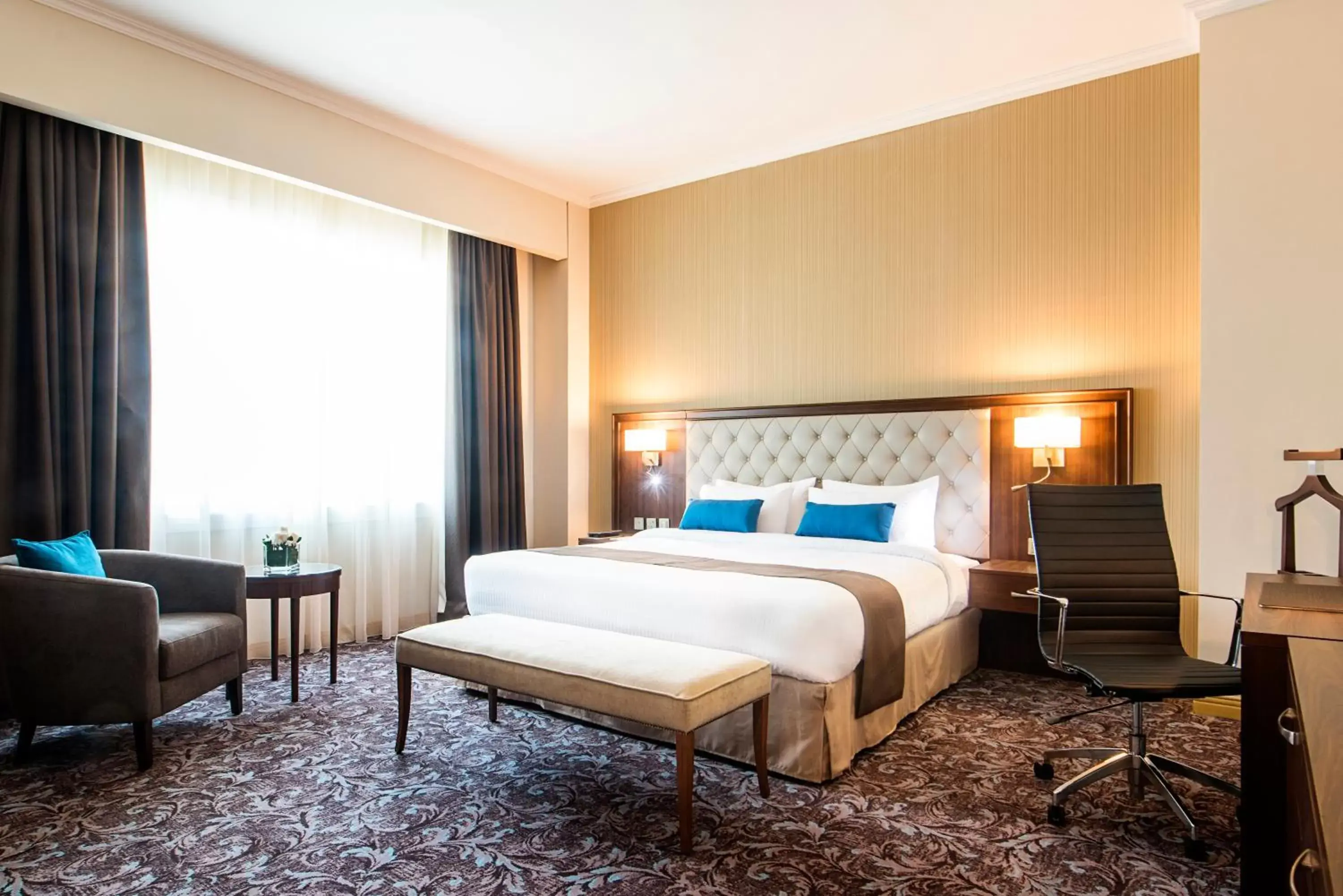 Bed in Golden Tulip Doha Hotel