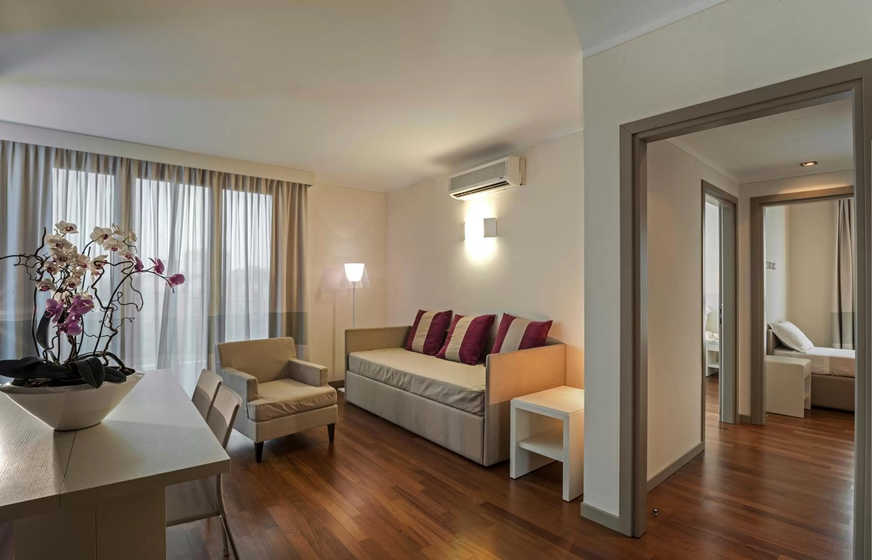 Living room, Bed in Ramada Plaza by Wyndham Milano