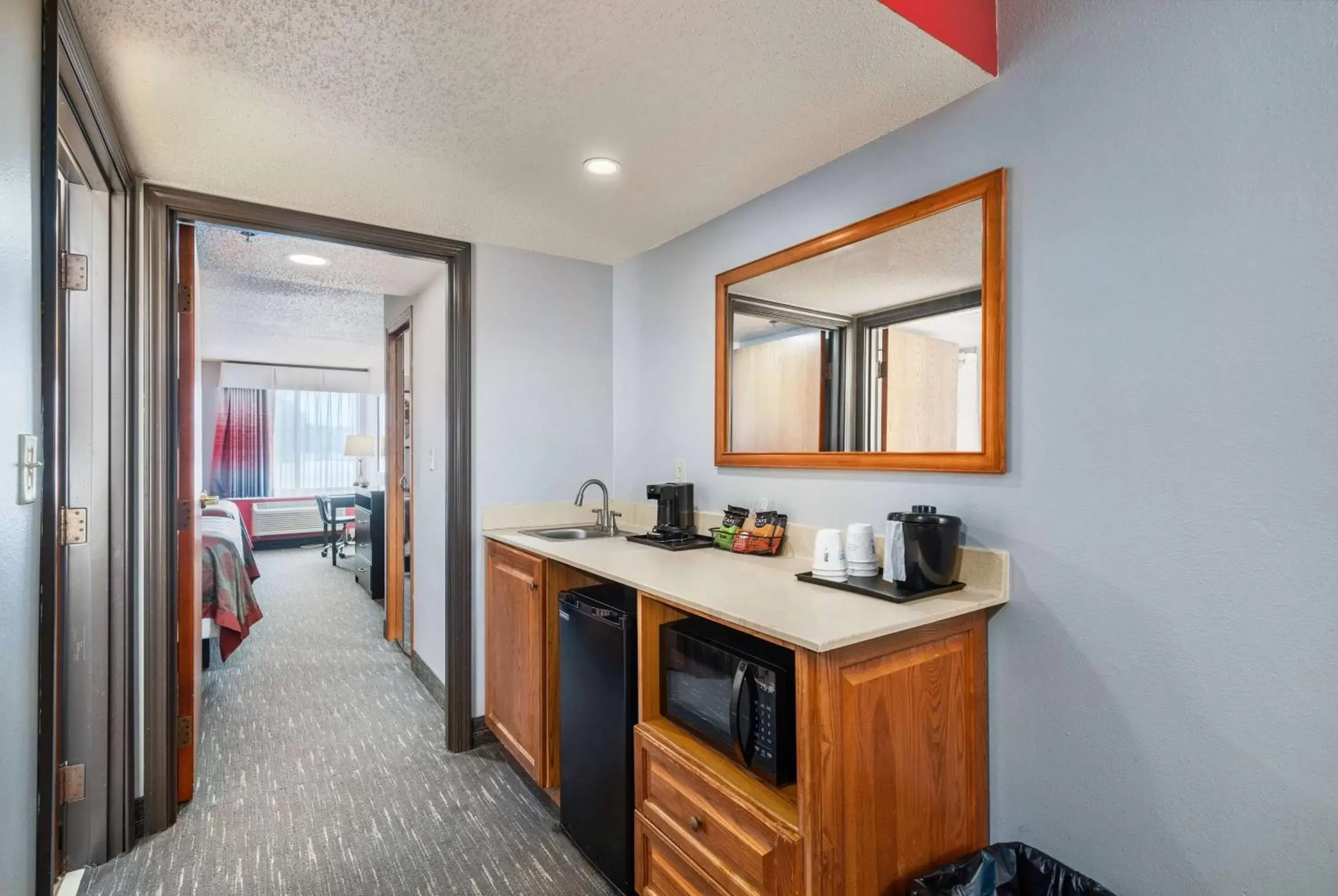 Photo of the whole room, Kitchen/Kitchenette in Ramada by Wyndham Sioux Falls Airport - Waterpark Resort & Event Center