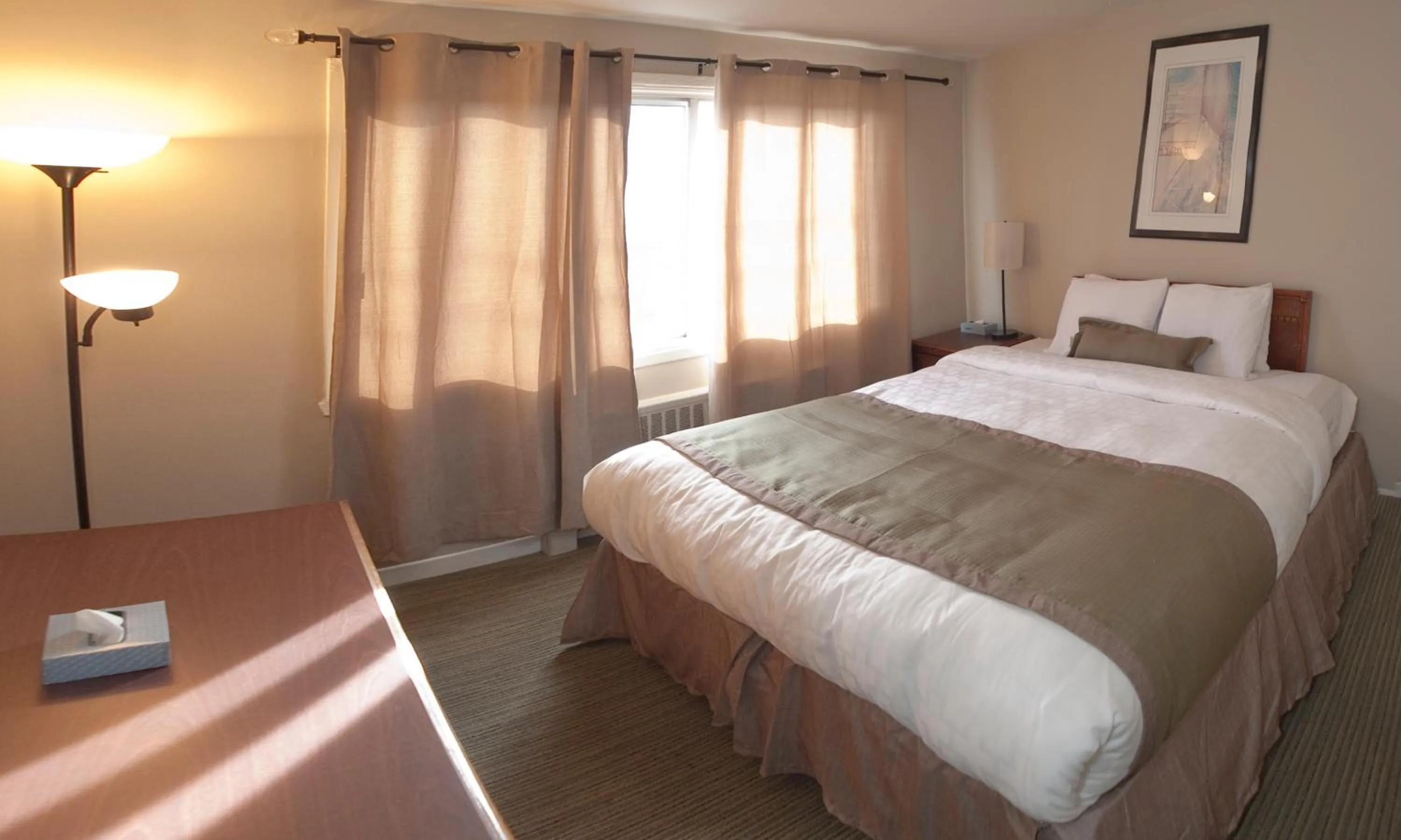 Bed in Beausejour Hotel Apartments/Hotel Dorval