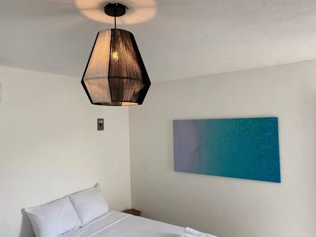 Bed in Casa Colibrí El Cuyo