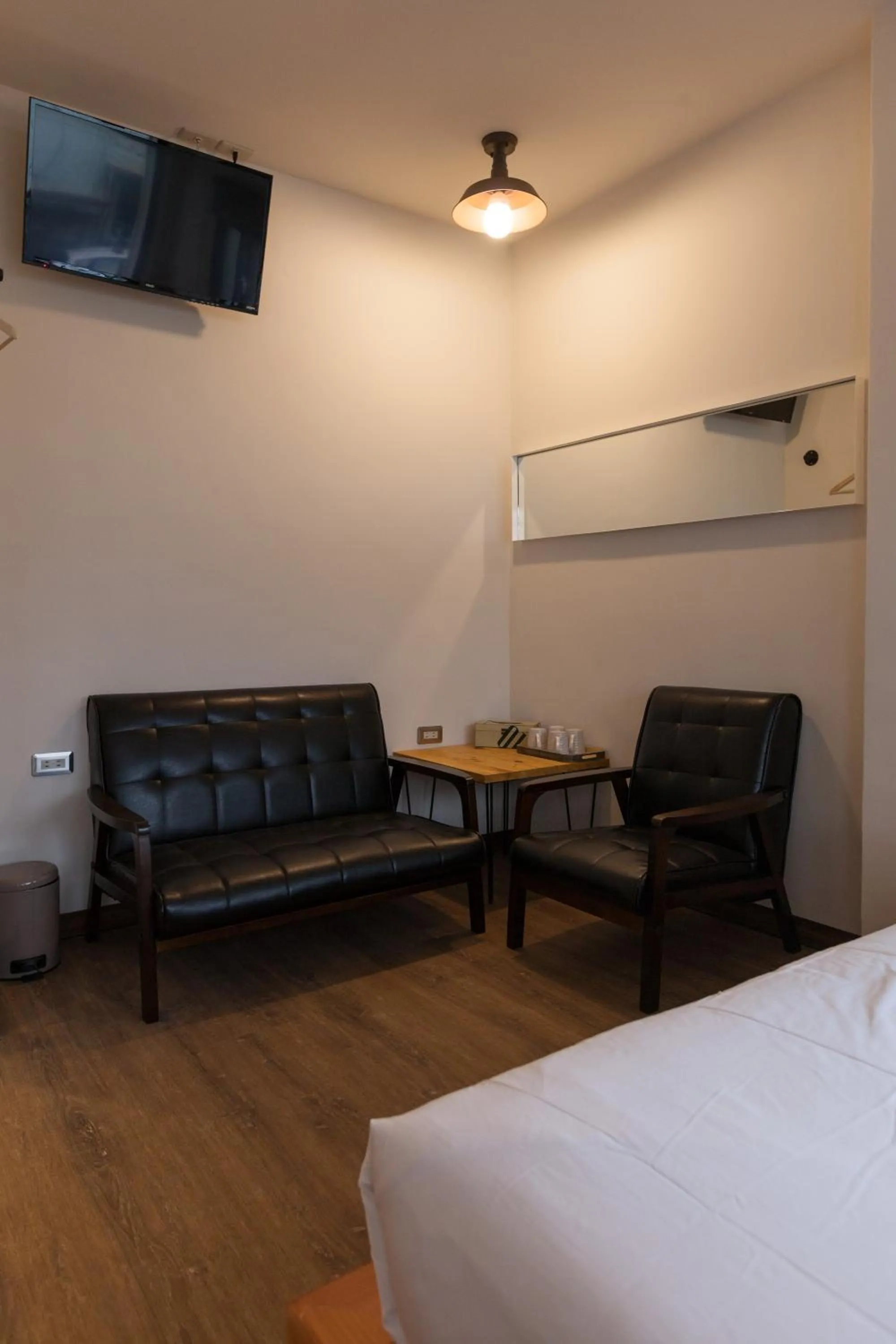 Seating area, Bed in Mini Voyage Hostel