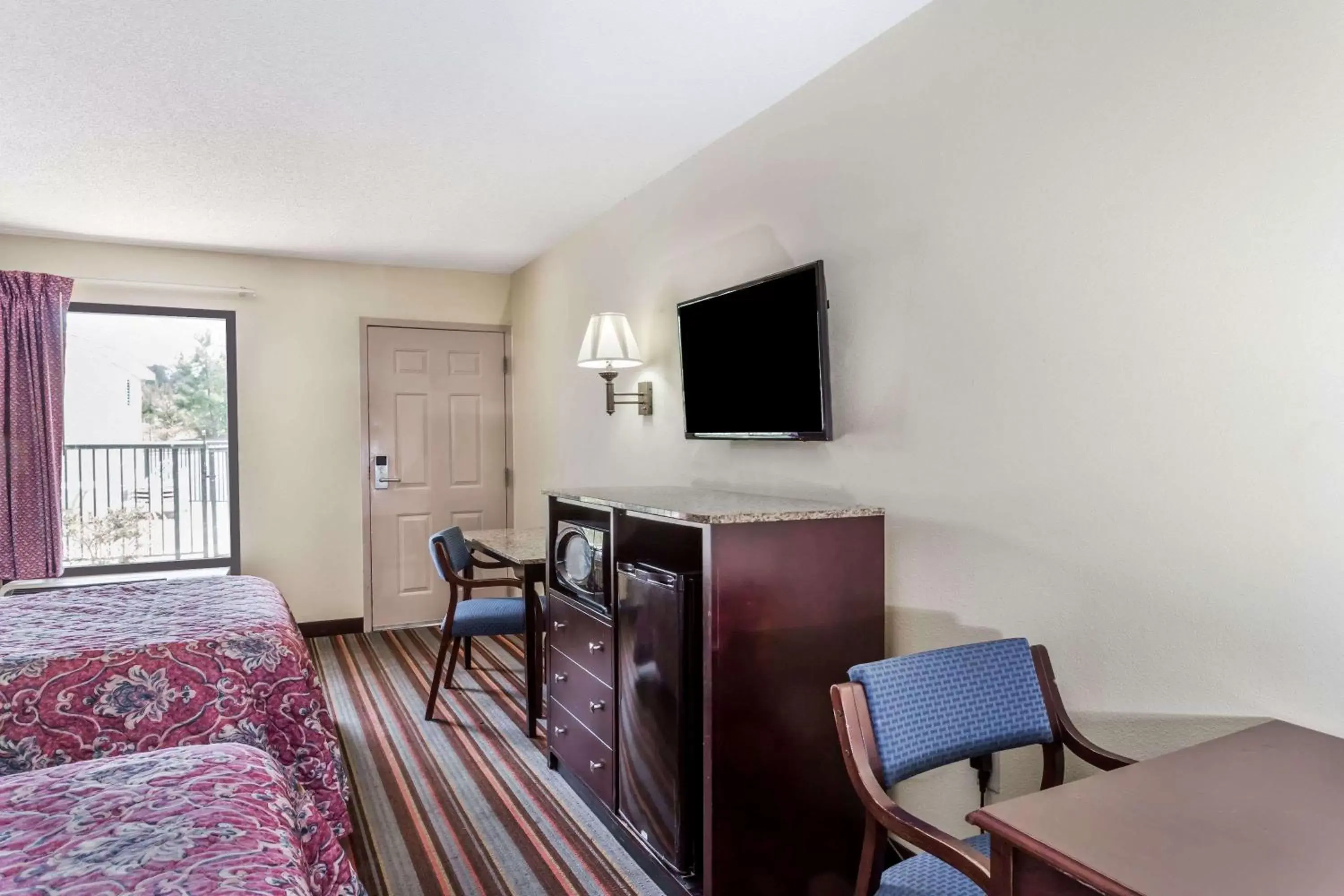 Photo of the whole room, TV/Entertainment Center in Days Inn by Wyndham Sanford