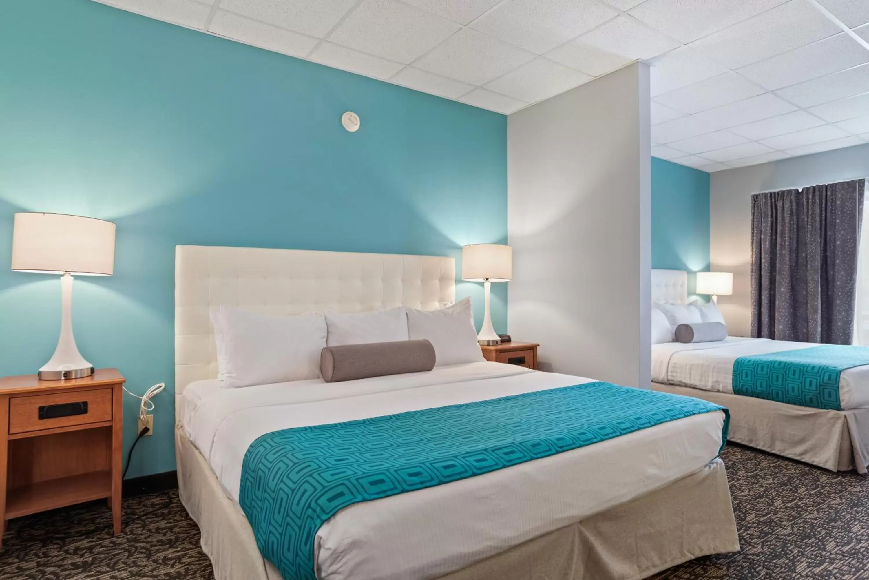 Bed in Howard Johnson by Wyndham Rapid City