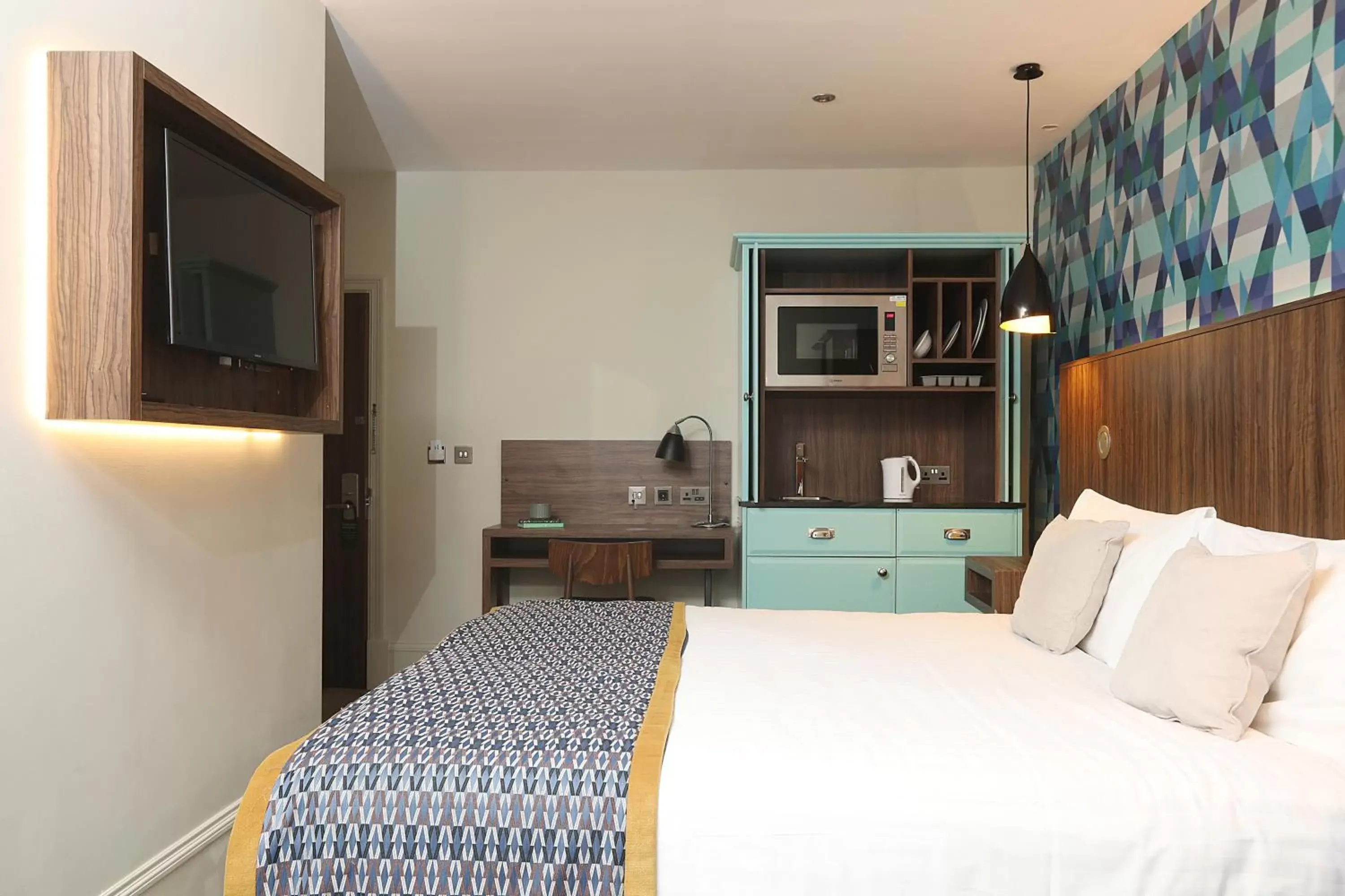 Bed in Cairn Hotel & Apartments
