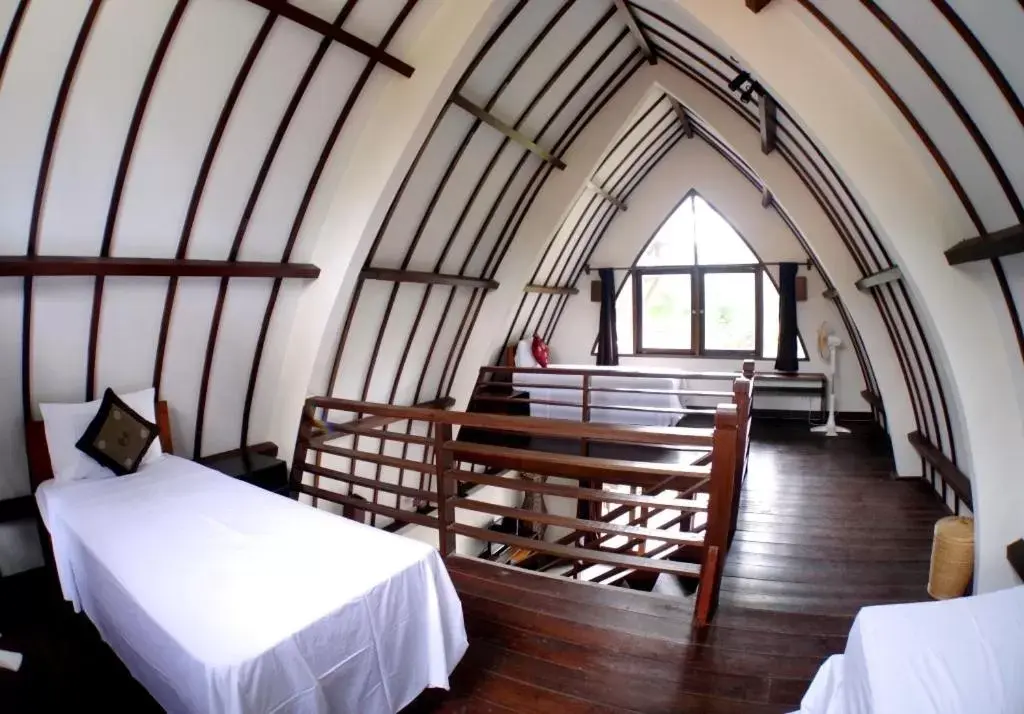 Bed in Oceans 5 Dive Resort Bed in Oceans 5 Dive Resort