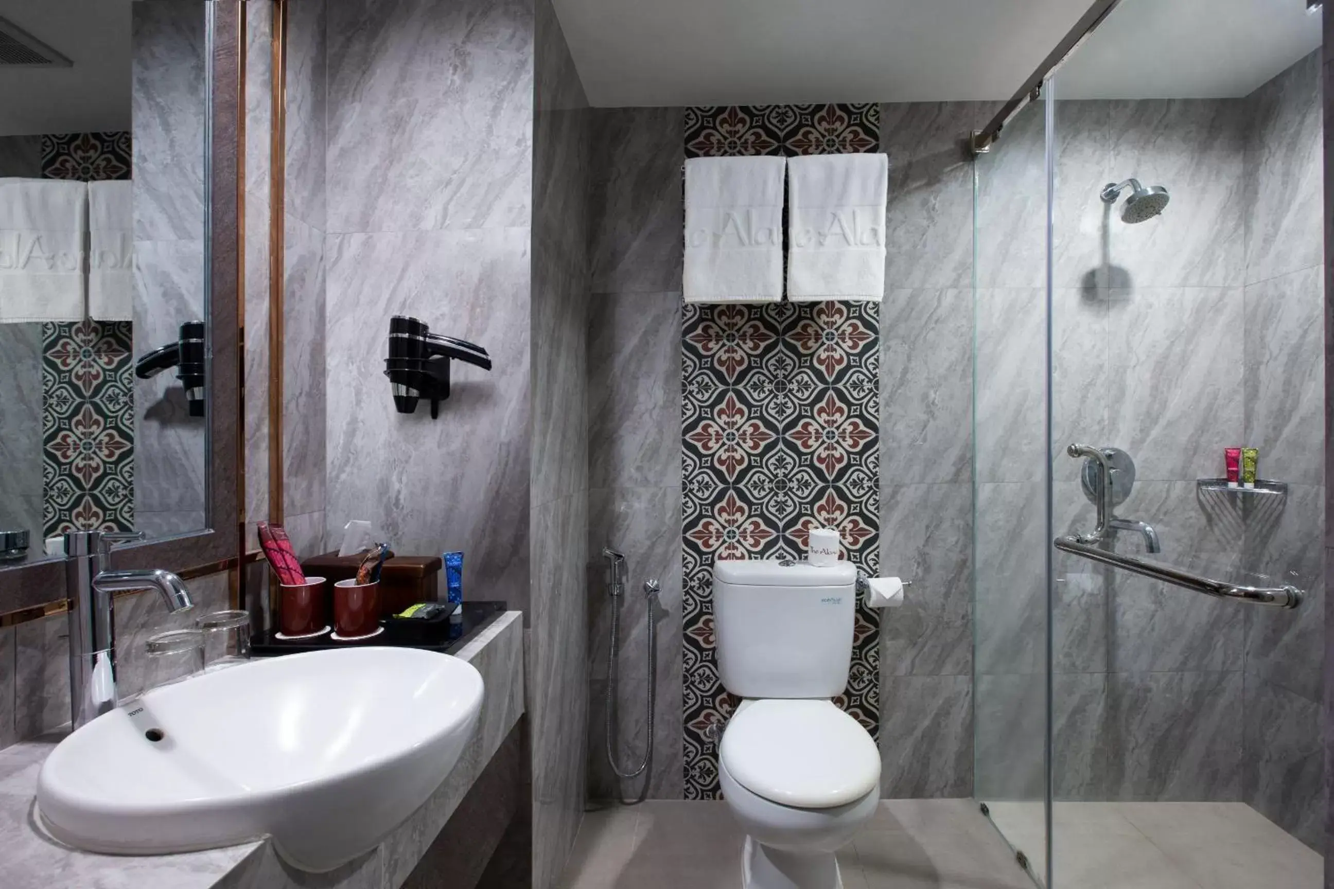 Bathroom in The Alana Hotel & Conference Center Malioboro Yogyakarta by ASTON