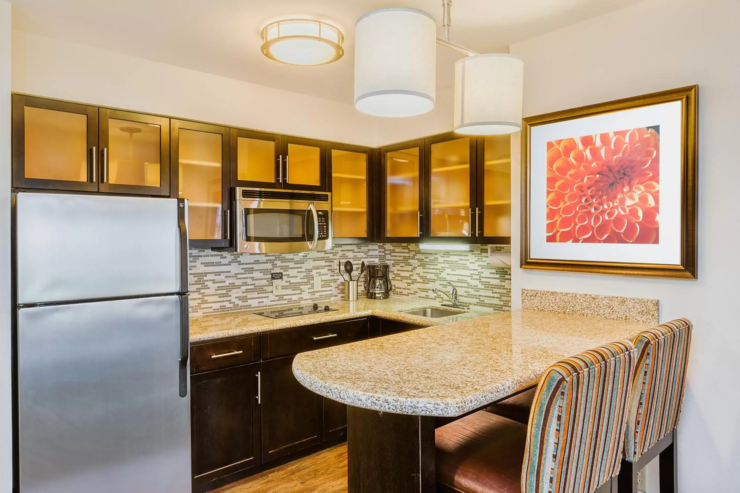 Photo of the whole room, Kitchen/Kitchenette in Staybridge Suites Bismarck, an IHG Hotel