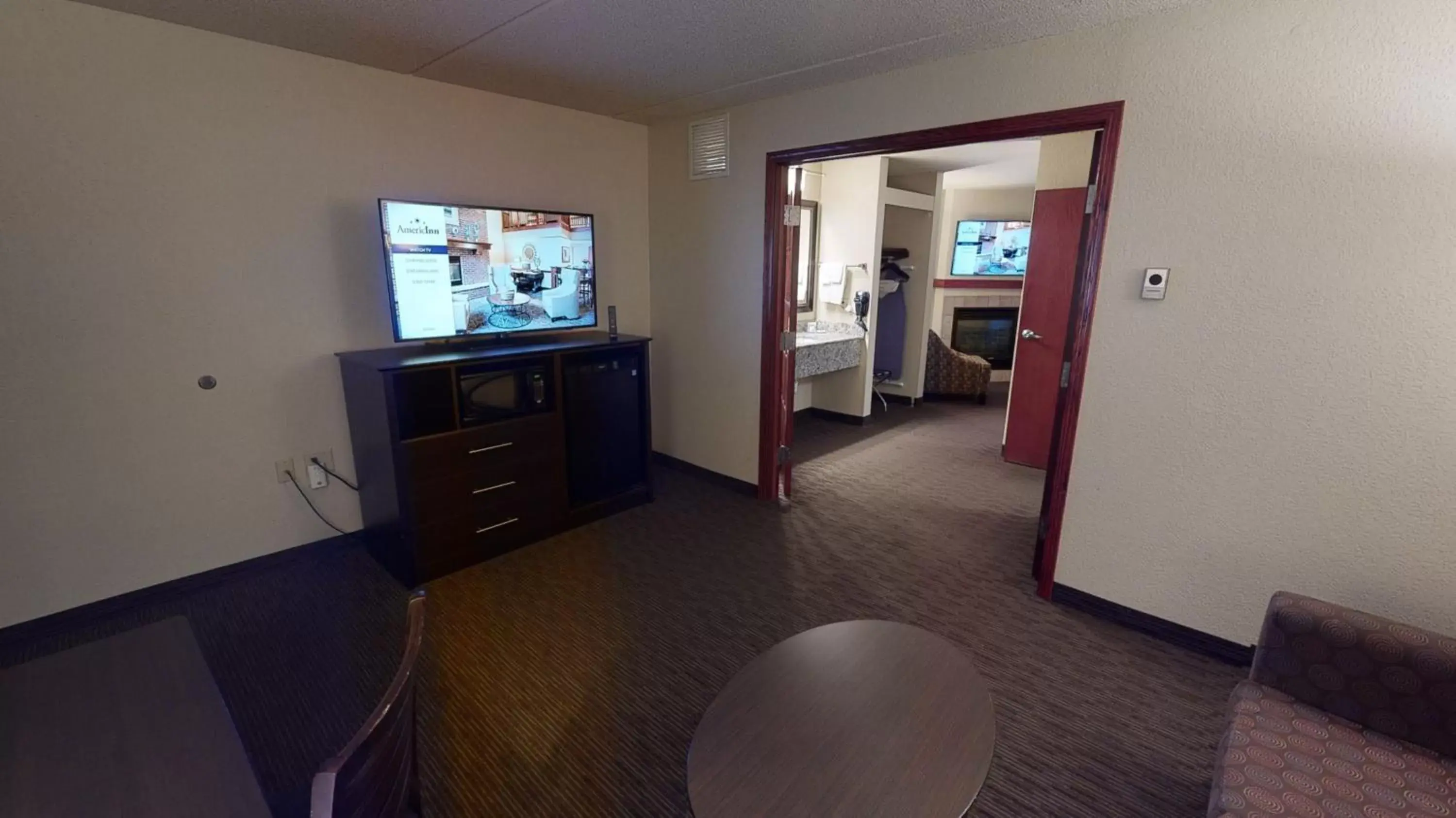 Living room, TV/Entertainment Center in AmericInn by Wyndham Mounds View Minneapolis