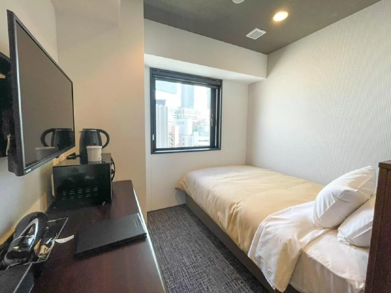 Bed in HOTEL LiVEMAX BUDGET Nagoya Shinkansen-guchi