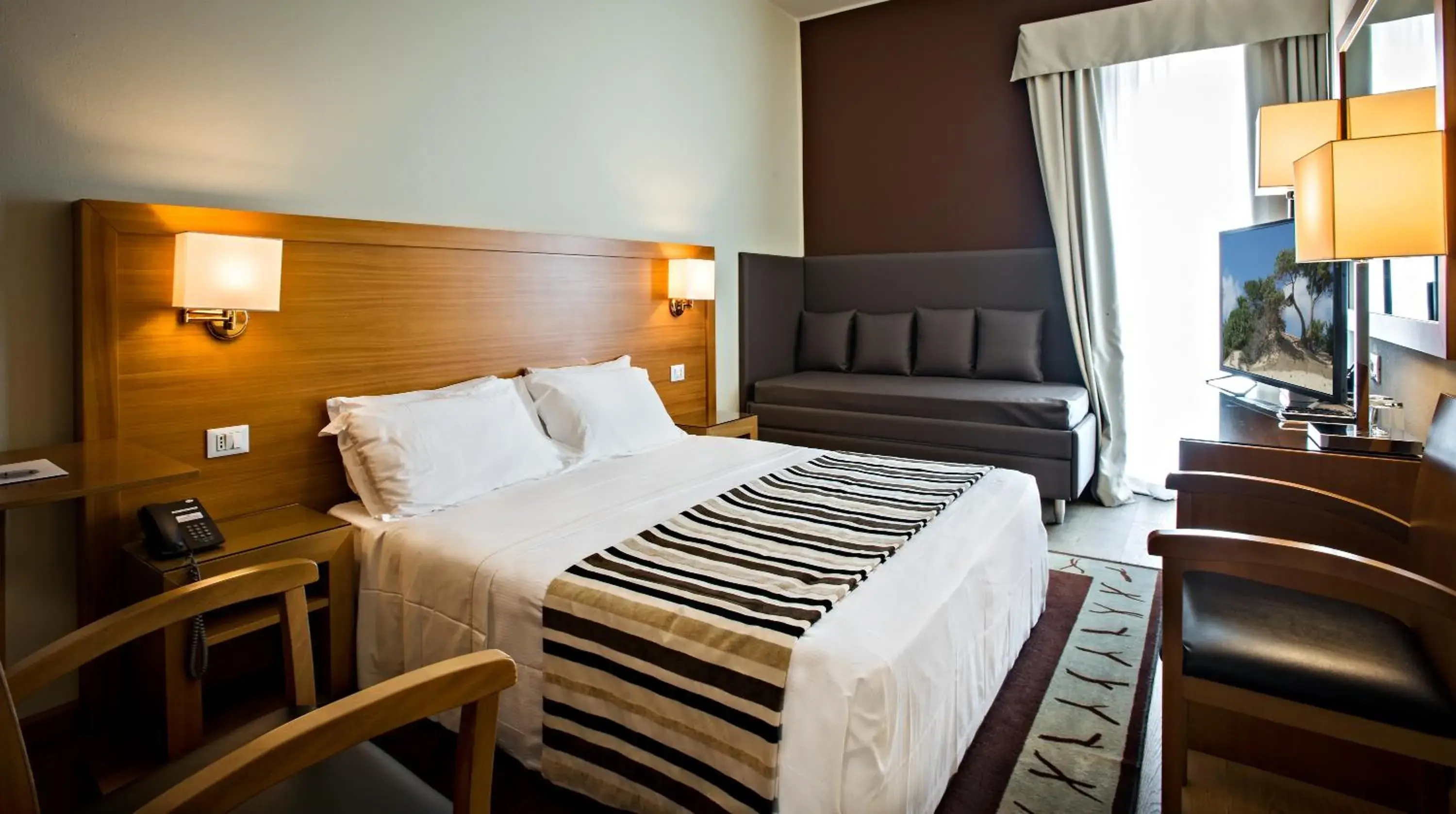 Bedroom in Sardegna Hotel - Suites & Restaurant