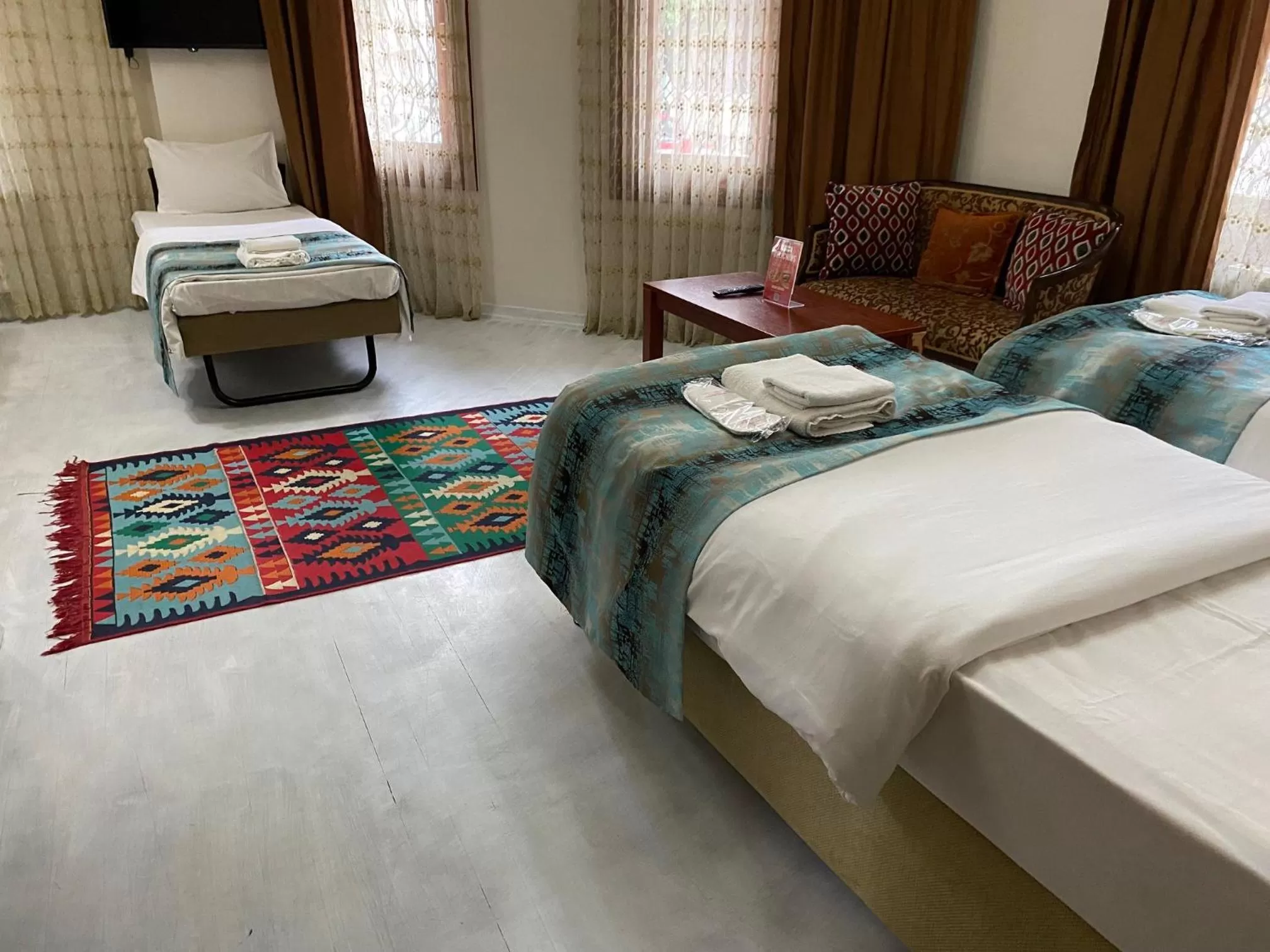 Photo of the whole room, Bed in Atam Suites