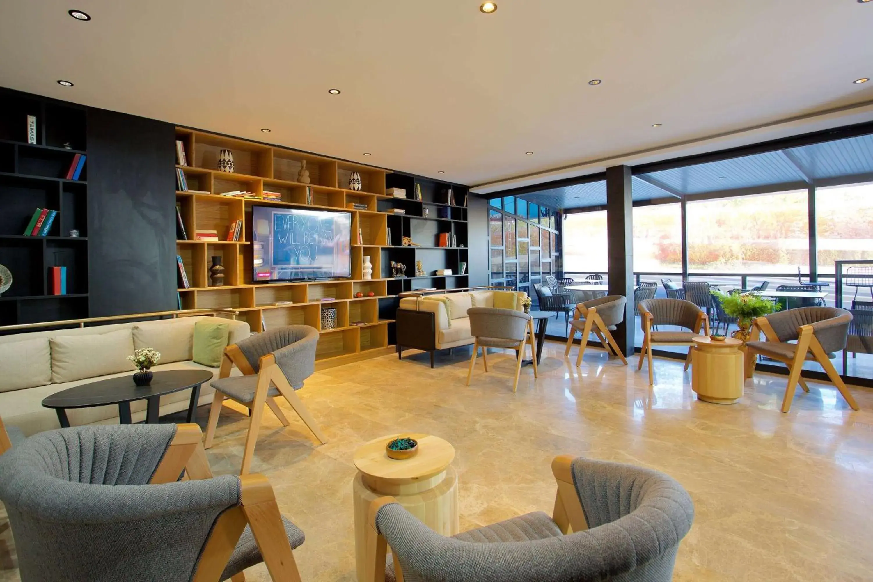 Communal lounge/ TV room, Lounge/Bar in Istanbul New Airport Hotel Trademark Collection by Wyndham