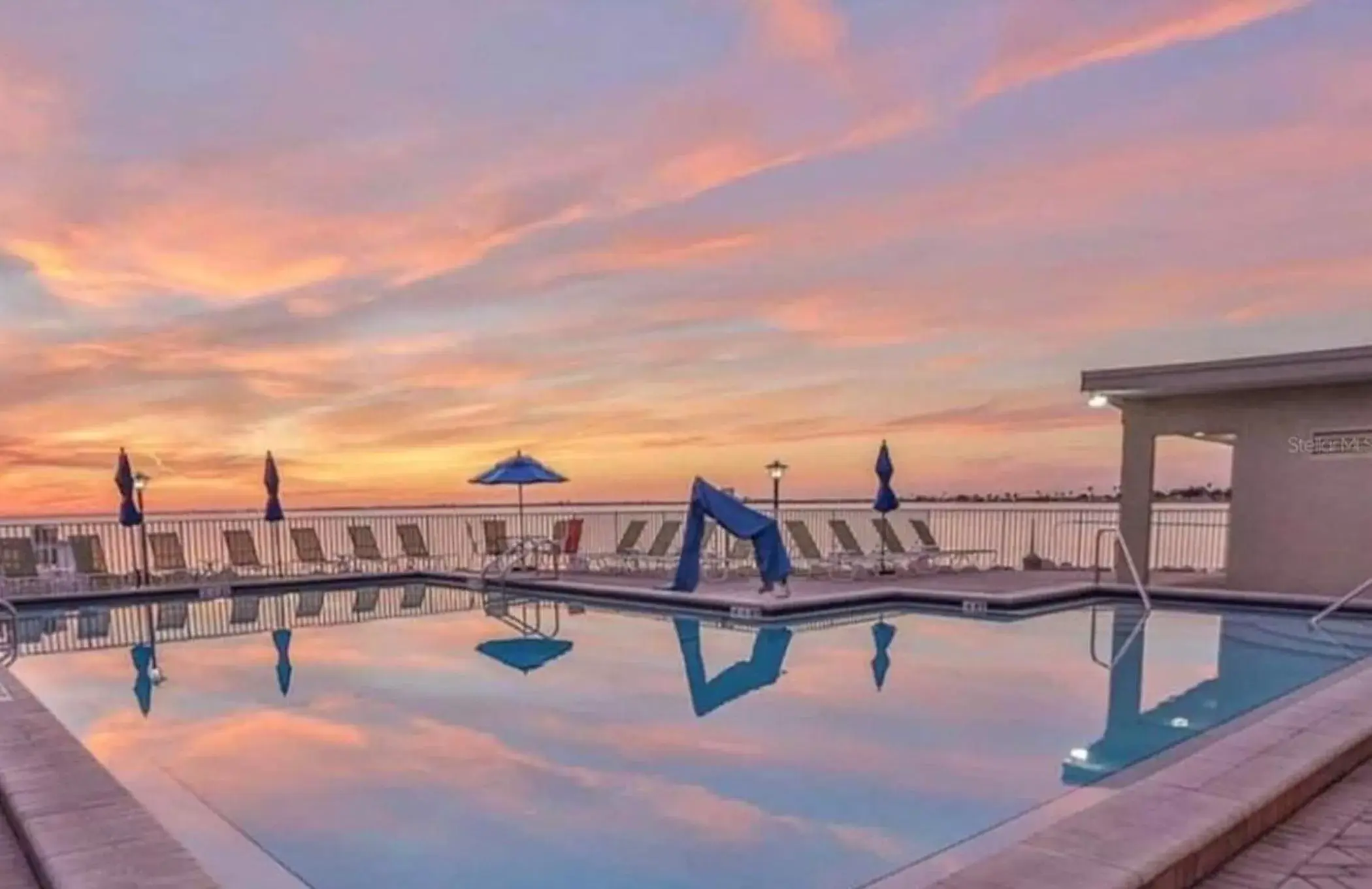 Swimming Pool in 2 Bed Condo with Balcony Facing Pool and Sunsets!