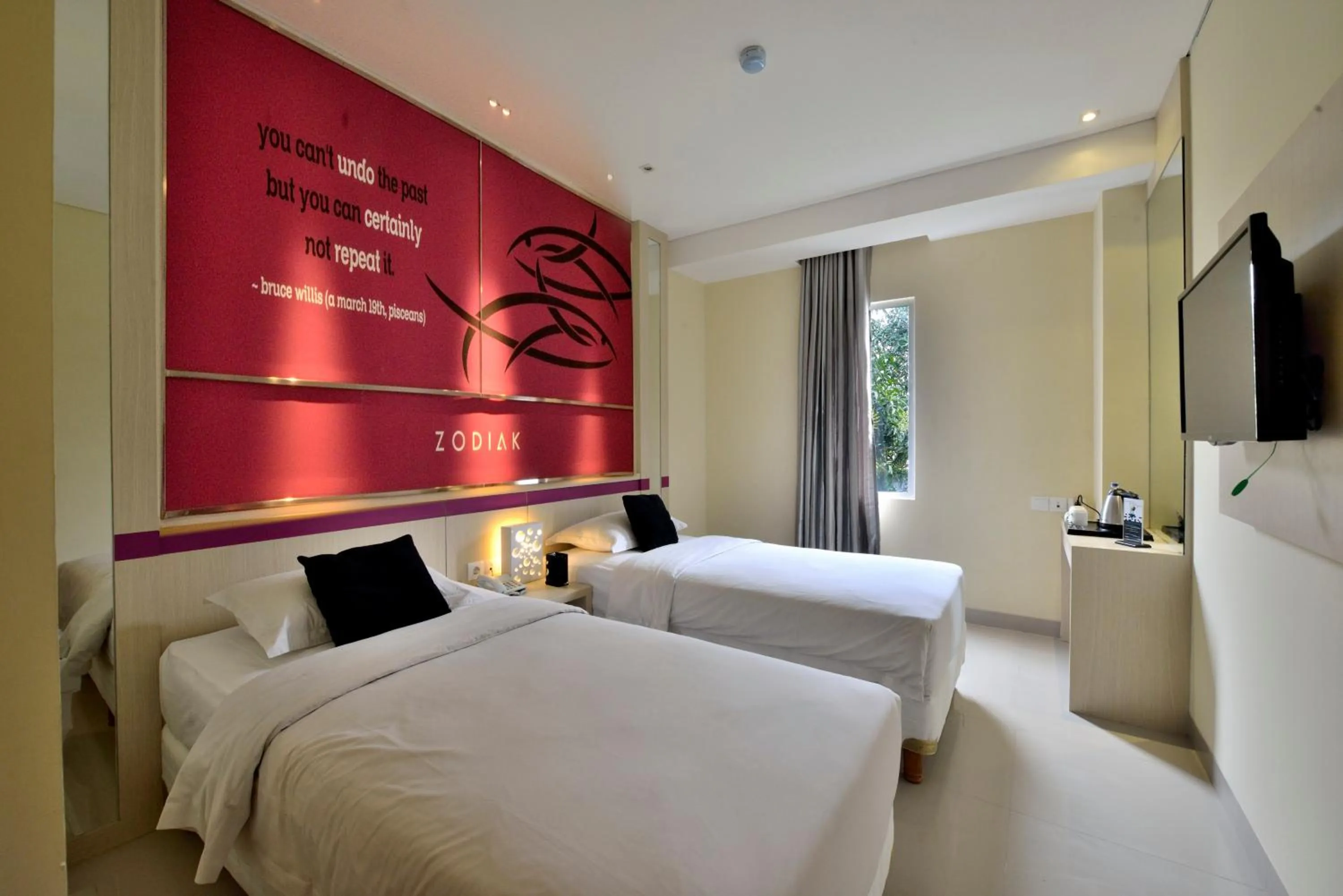 Bed in Zodiak Kebon Kawung by KAGUM Hotels