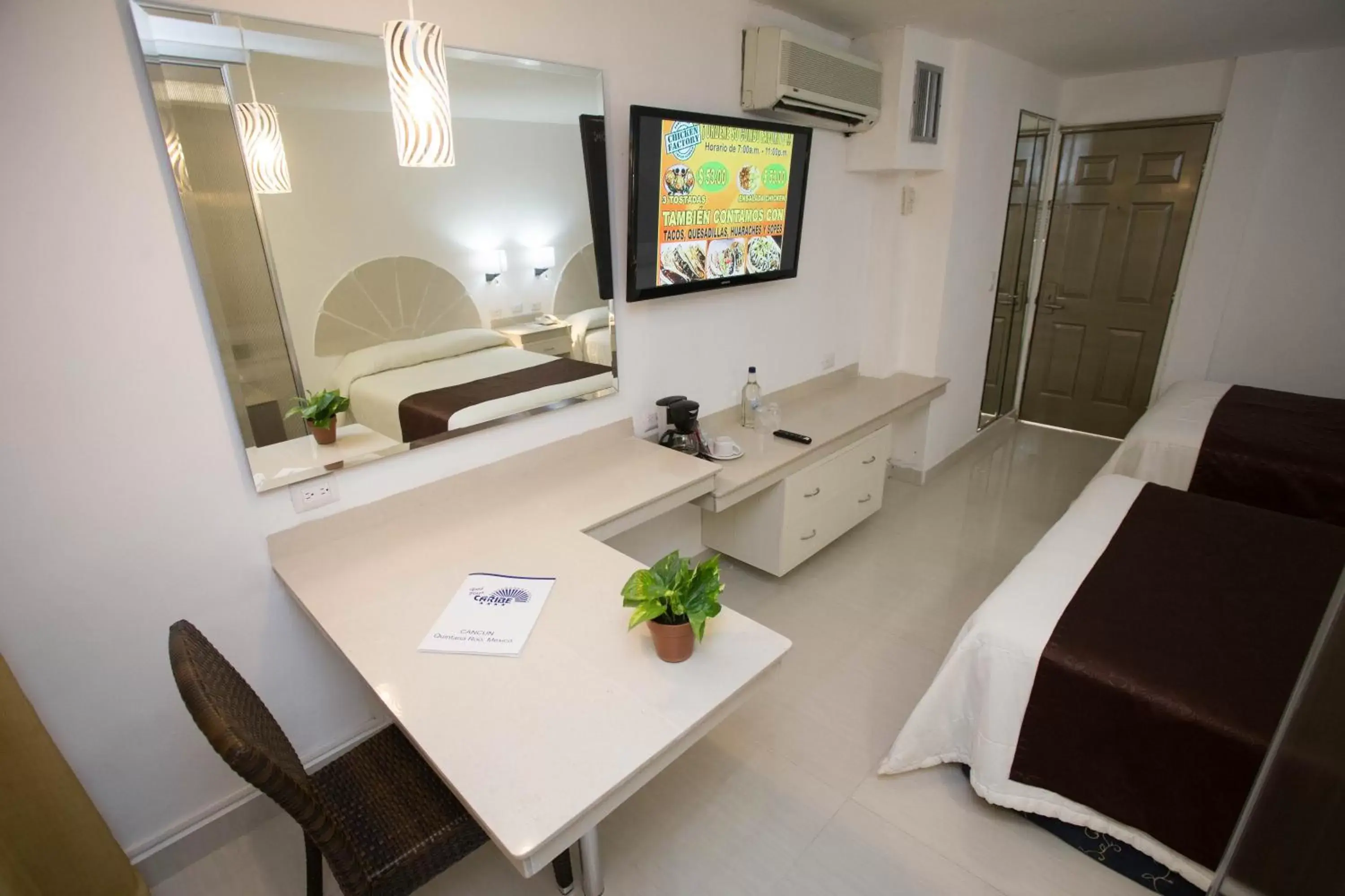 TV and multimedia, TV/Entertainment Center in Hotel Plaza Caribe