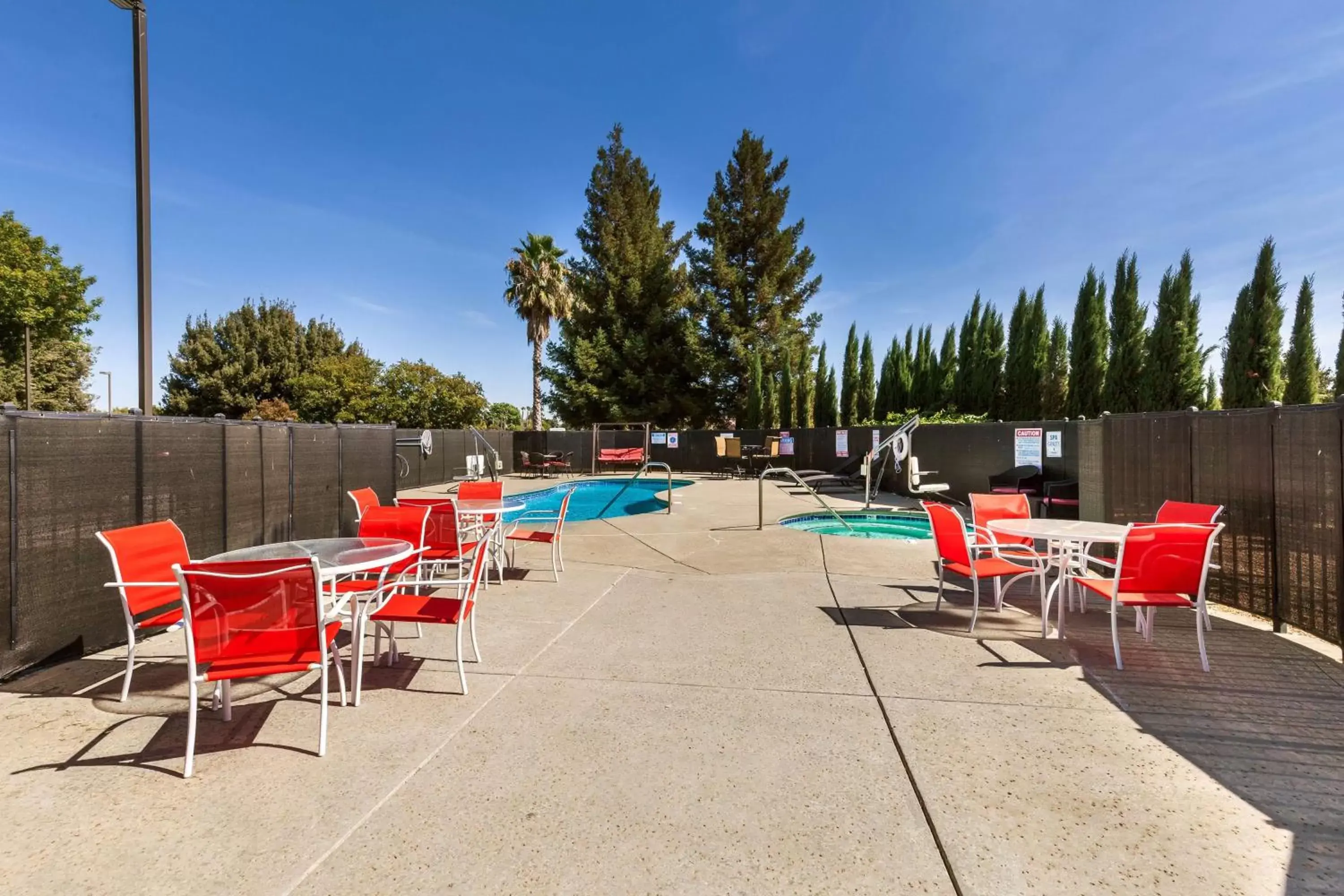 Seating area, Swimming Pool in Motel 6-Dixon, CA