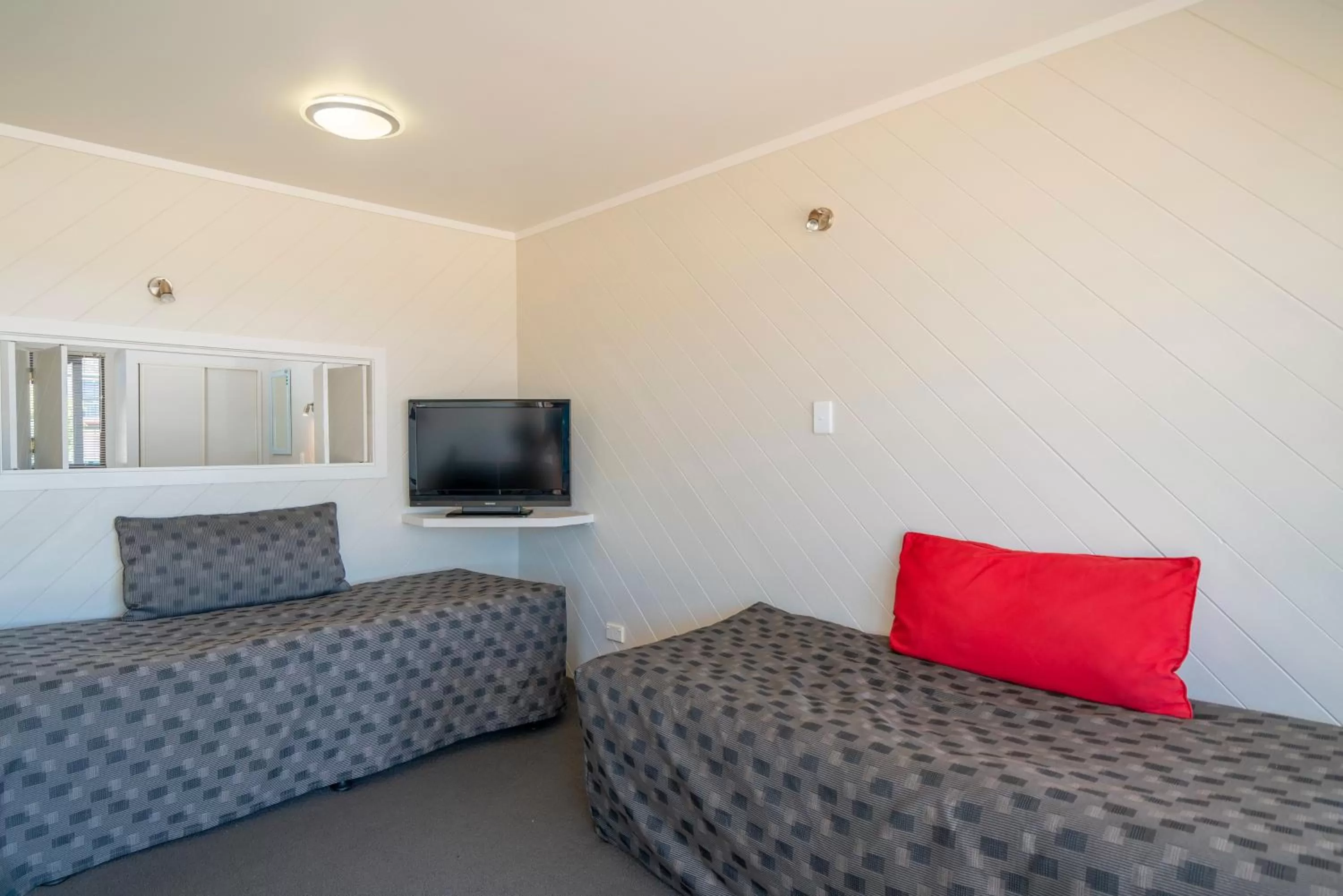 Bed in The Oceanside Motel