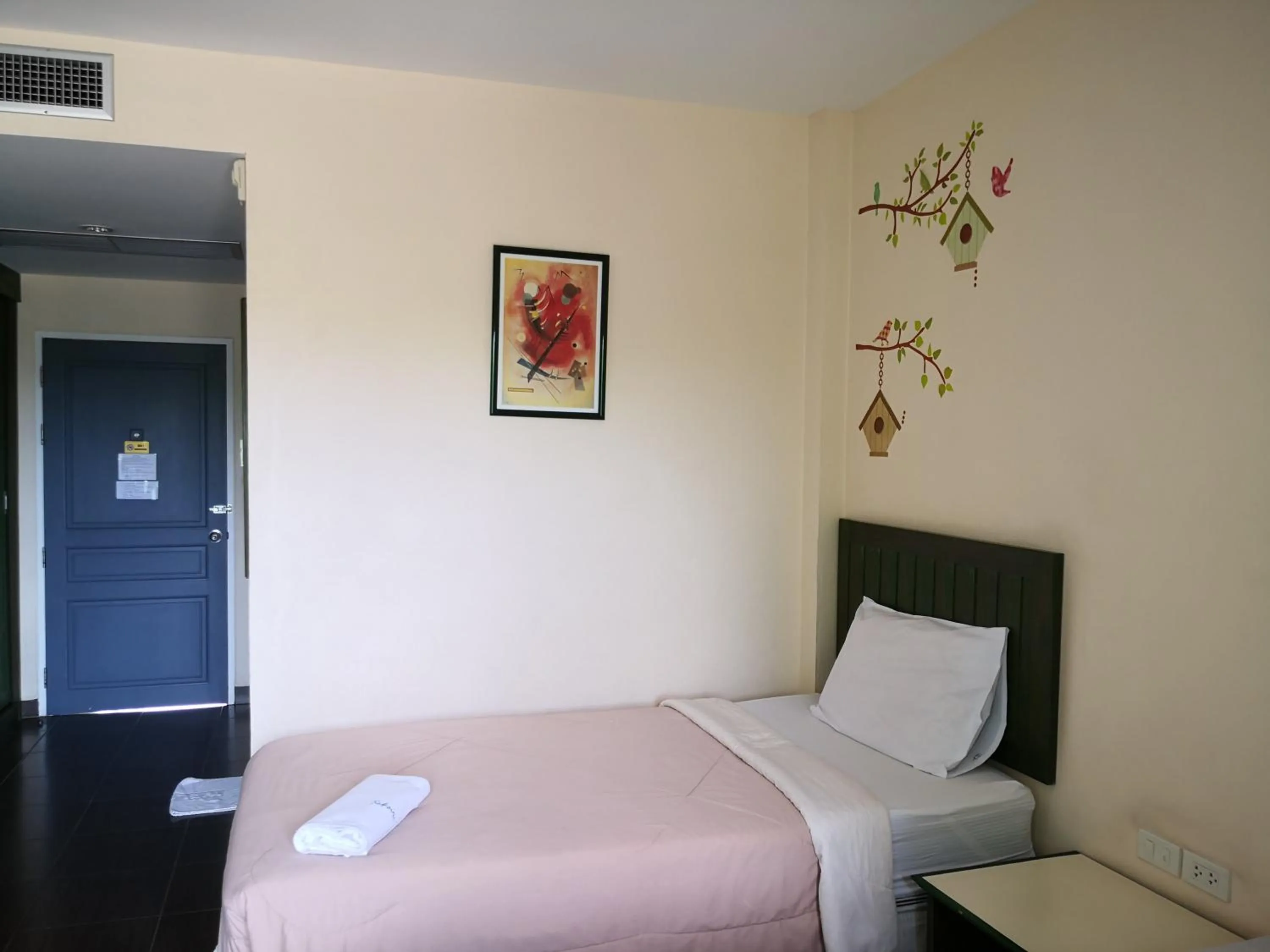 Bed in Baan Suksiri Hotel