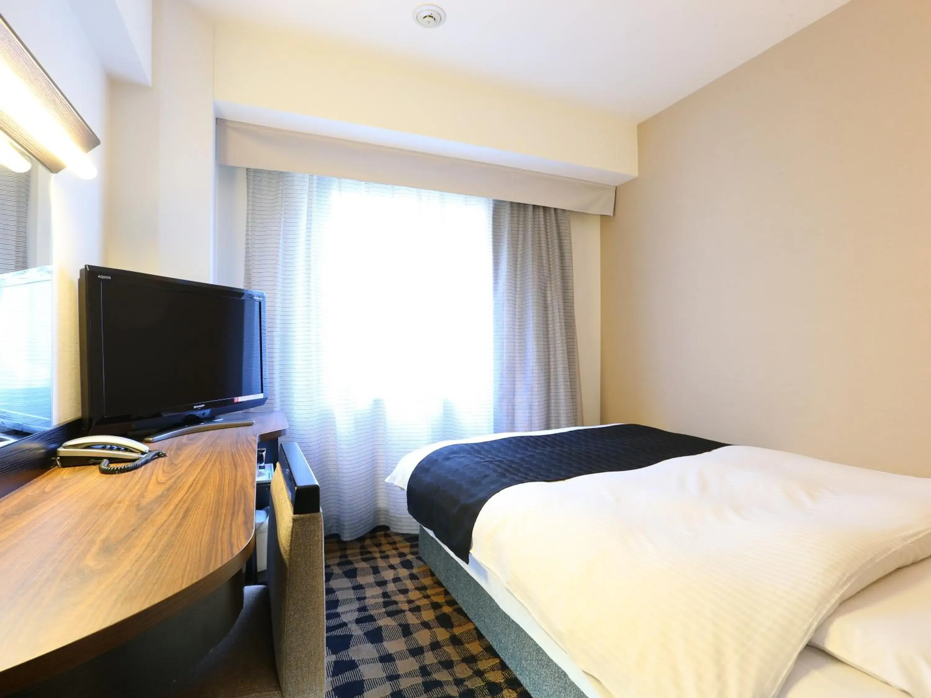 Photo of the whole room, Bed in APA Hotel Hatchobori-Eki-Minami