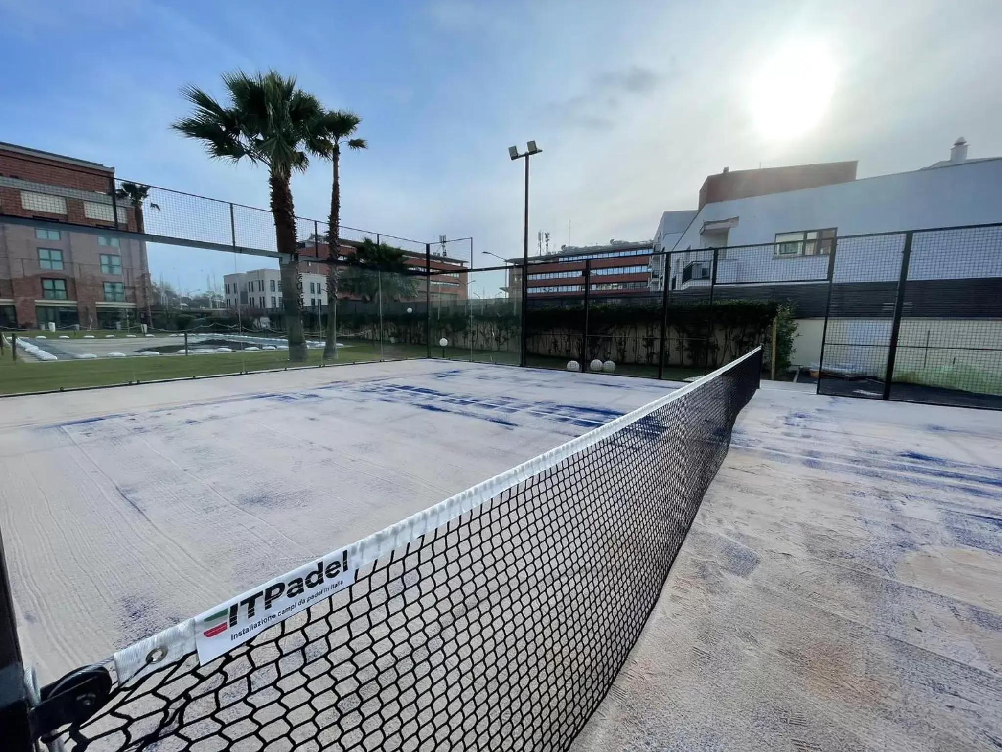 Tennis court, Swimming Pool in Mercure Leonardo da Vinci Rome Airport