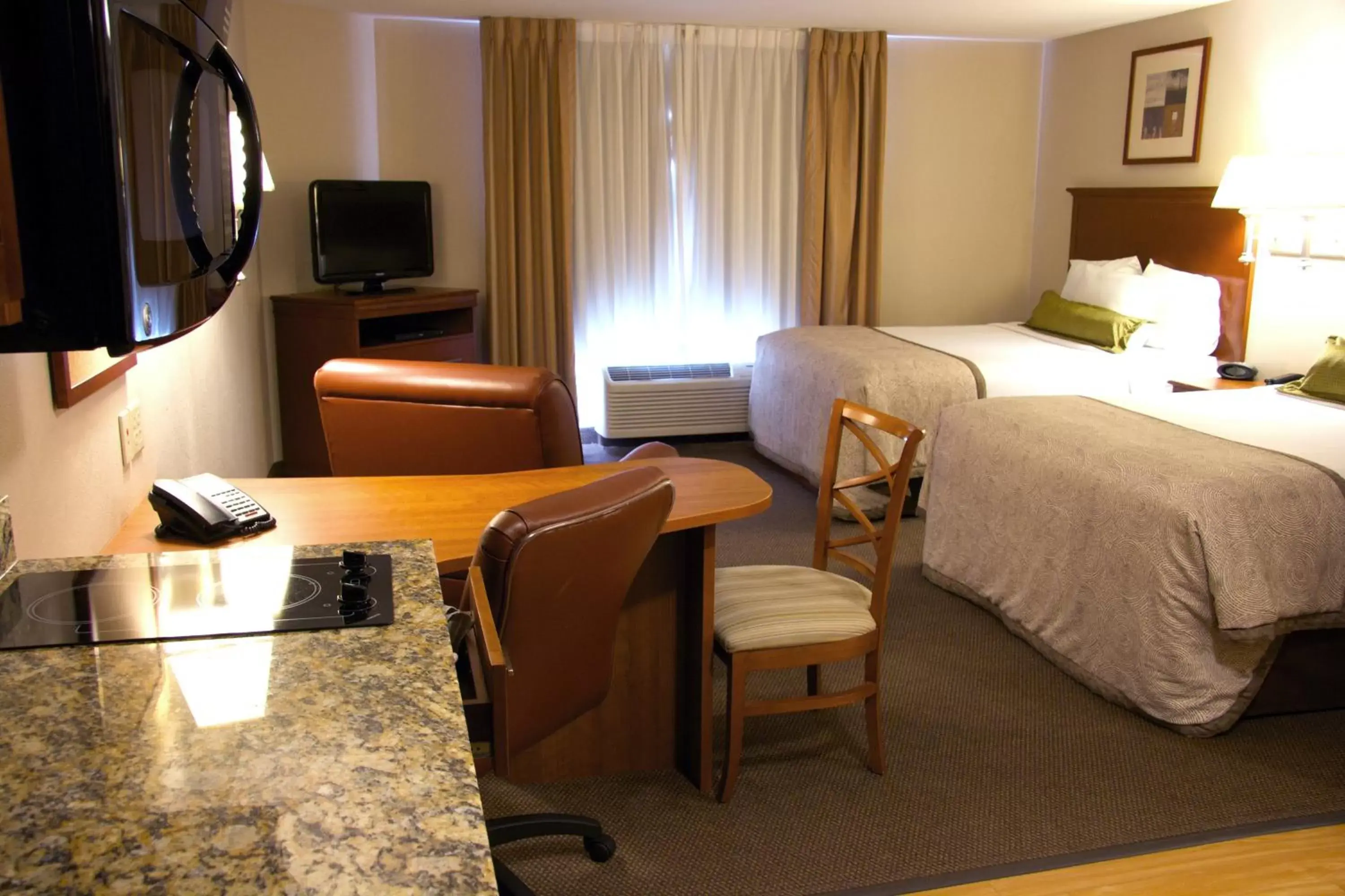 Photo of the whole room, Bed in Candlewood Suites Champaign-Urbana University Area, an IHG Hotel