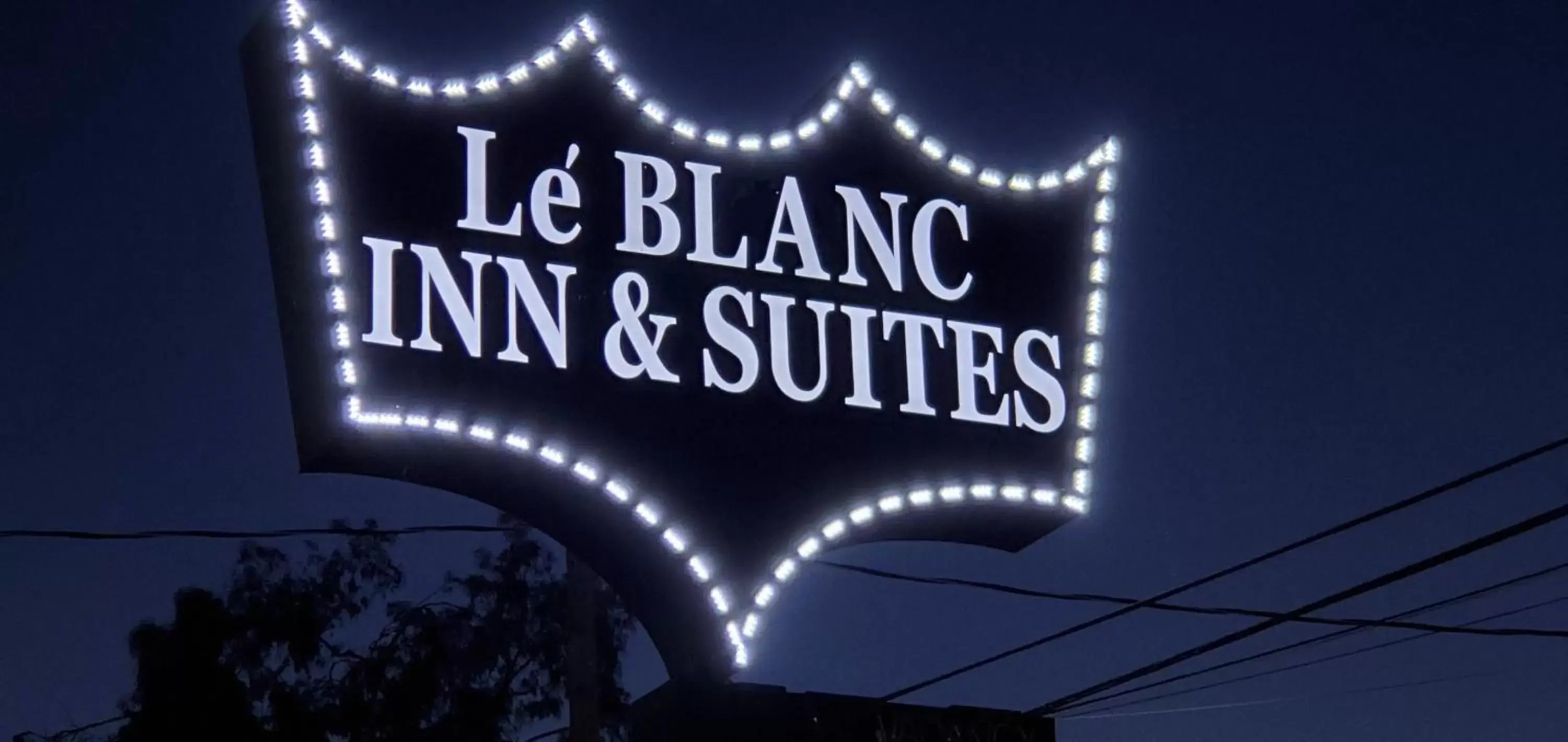 Property logo or sign in Le Blanc Inn & Suites