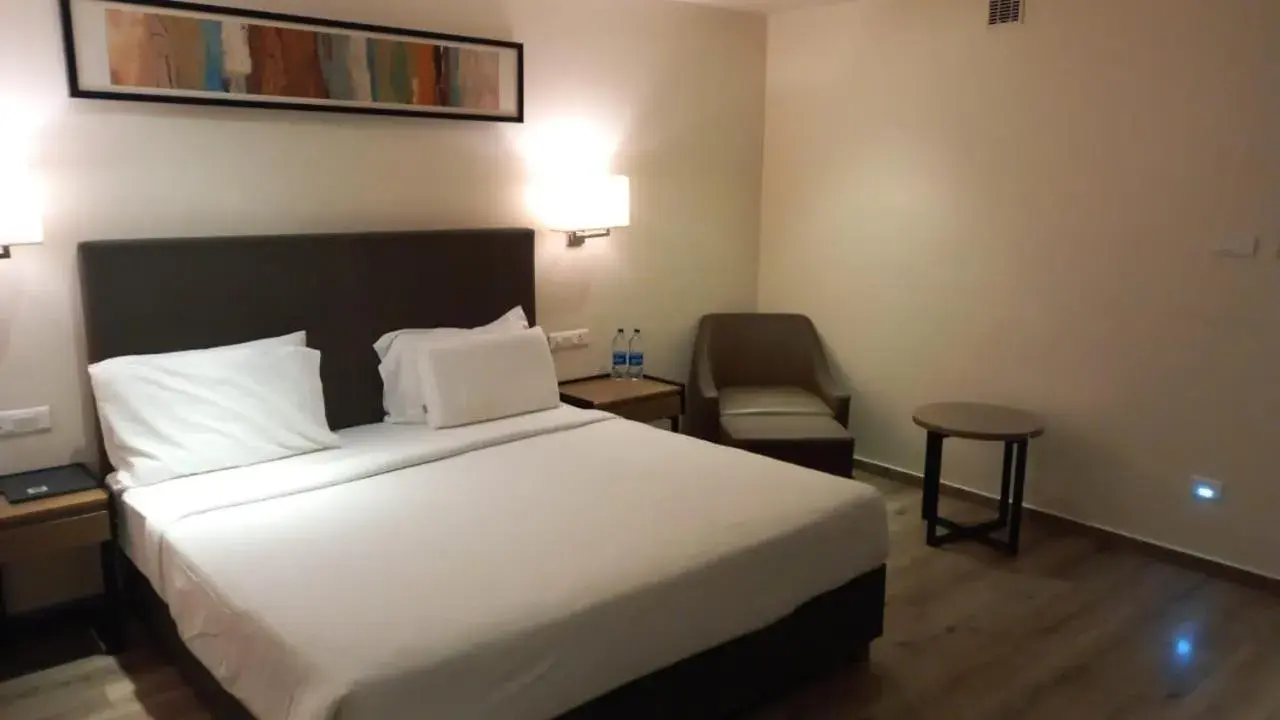 Bed in Quality Inn Ramachandra Bed in Quality Inn Ramachandra