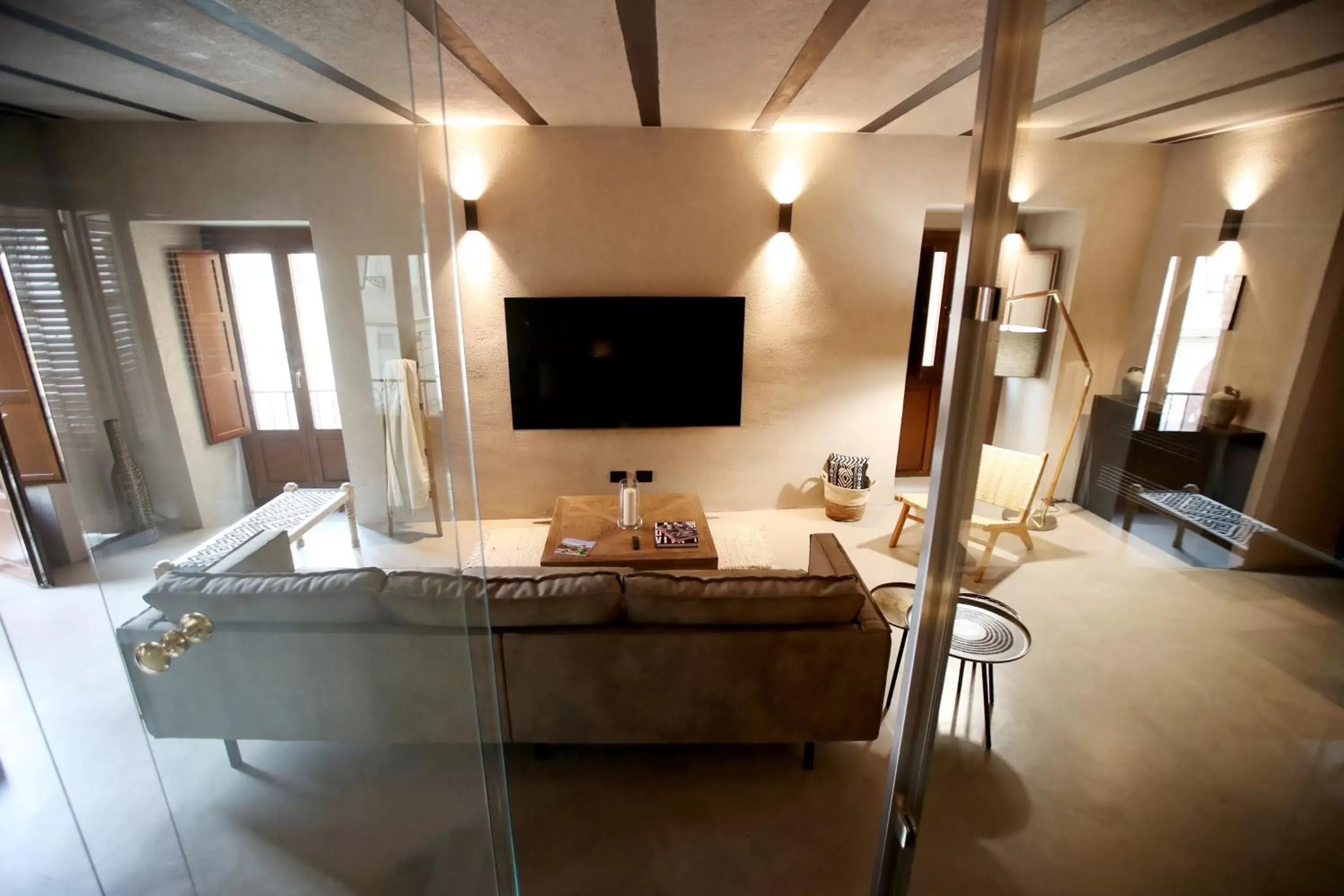 Communal lounge/ TV room, TV/Entertainment Center in Casa Nostra Luxury Suites