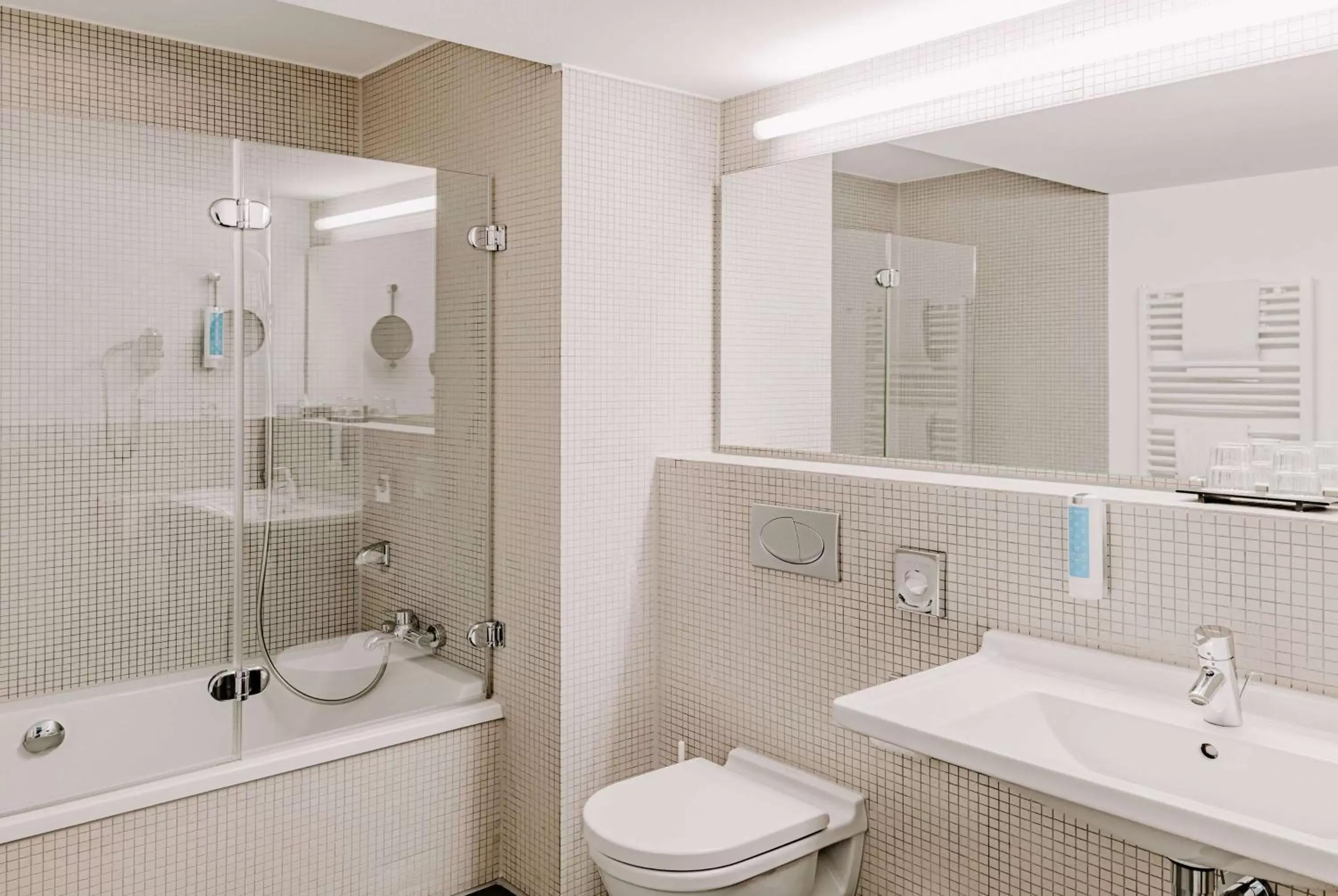 TV and multimedia, Bathroom in Vienna House Easy by Wyndham Stuttgart