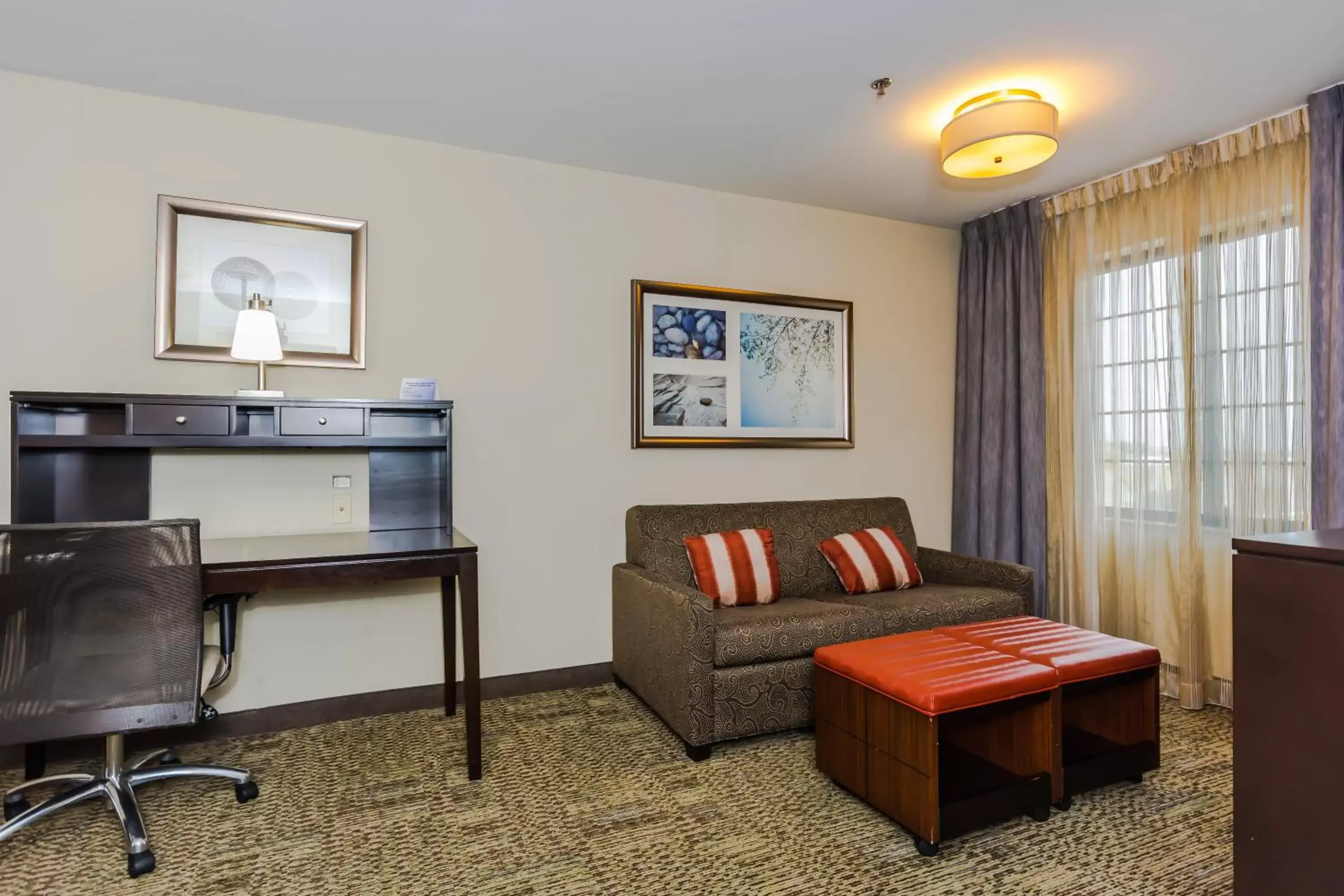 Photo of the whole room, Seating Area in Staybridge Suites Grand Forks, an IHG Hotel