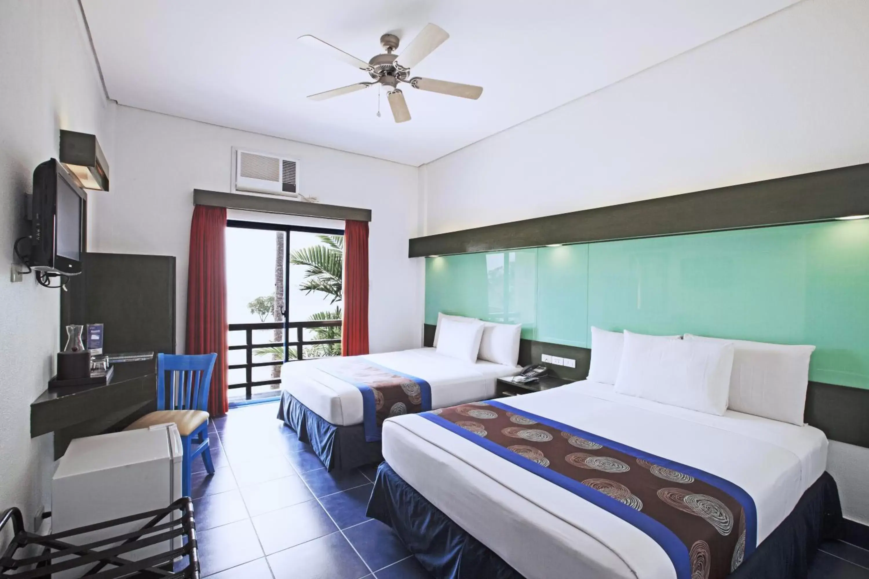 Photo of the whole room, Bed in Microtel by Wyndham Puerto Princesa