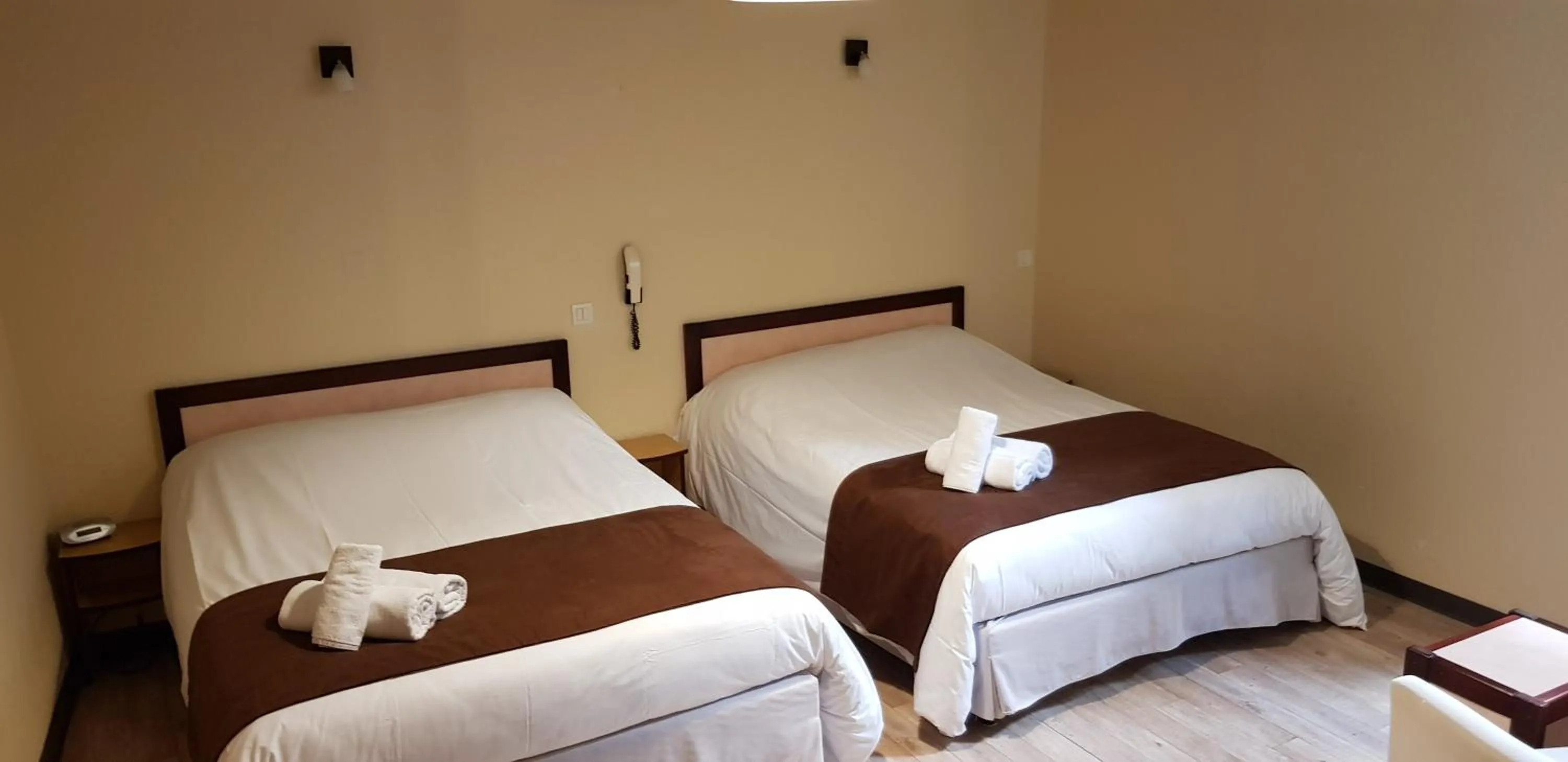 Bed in Logis Hotel le Prieuré