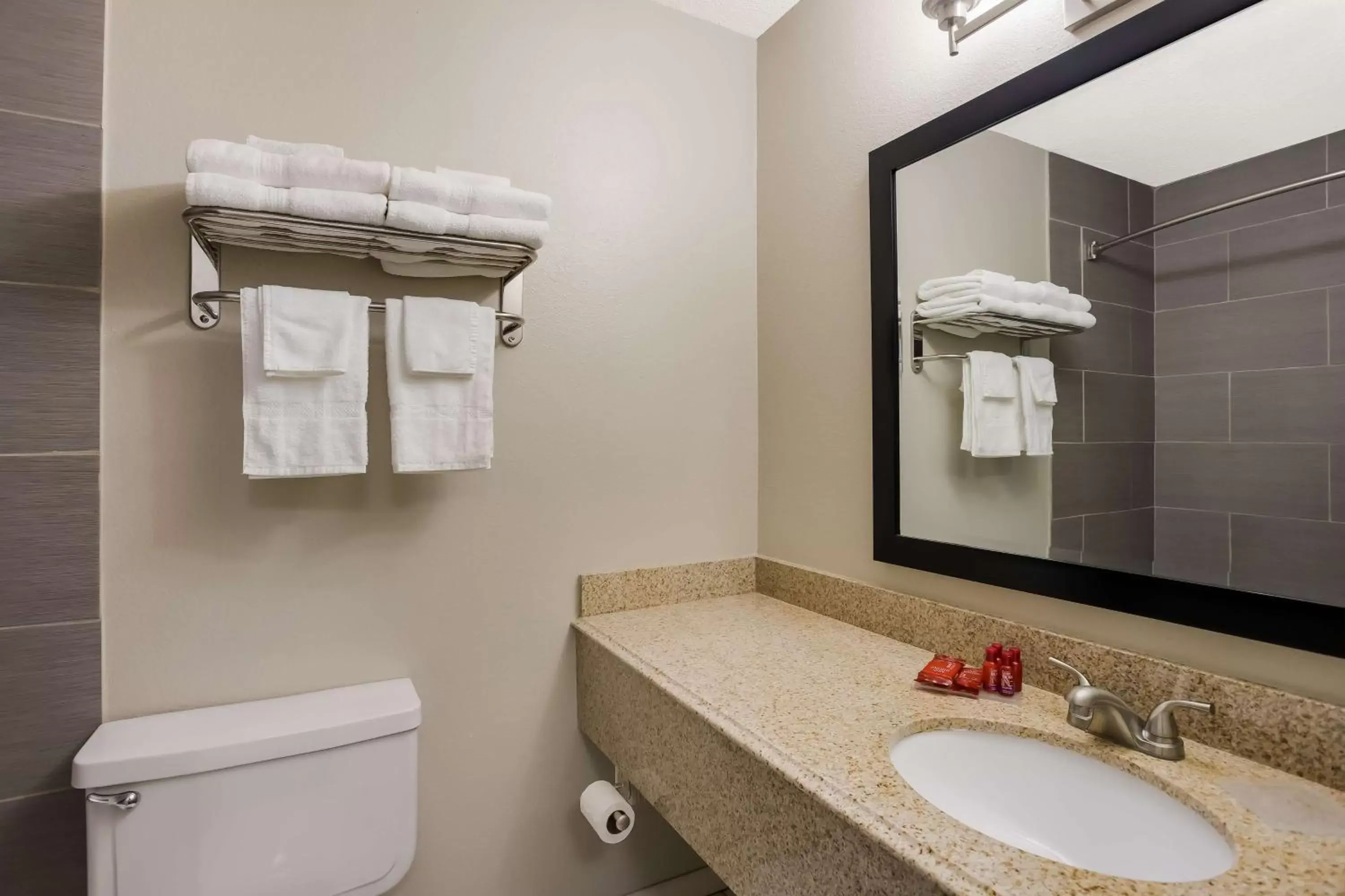 Bathroom in SureStay Hotel by Best Western Higginsville