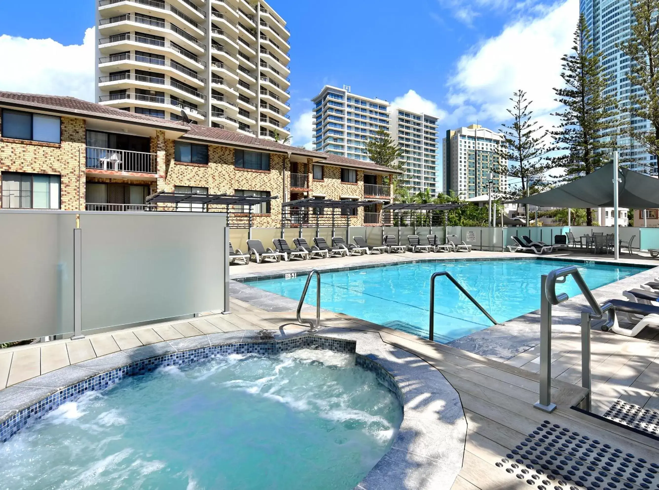 Hot Tub, Swimming Pool in Surfers Century Oceanside Apartments