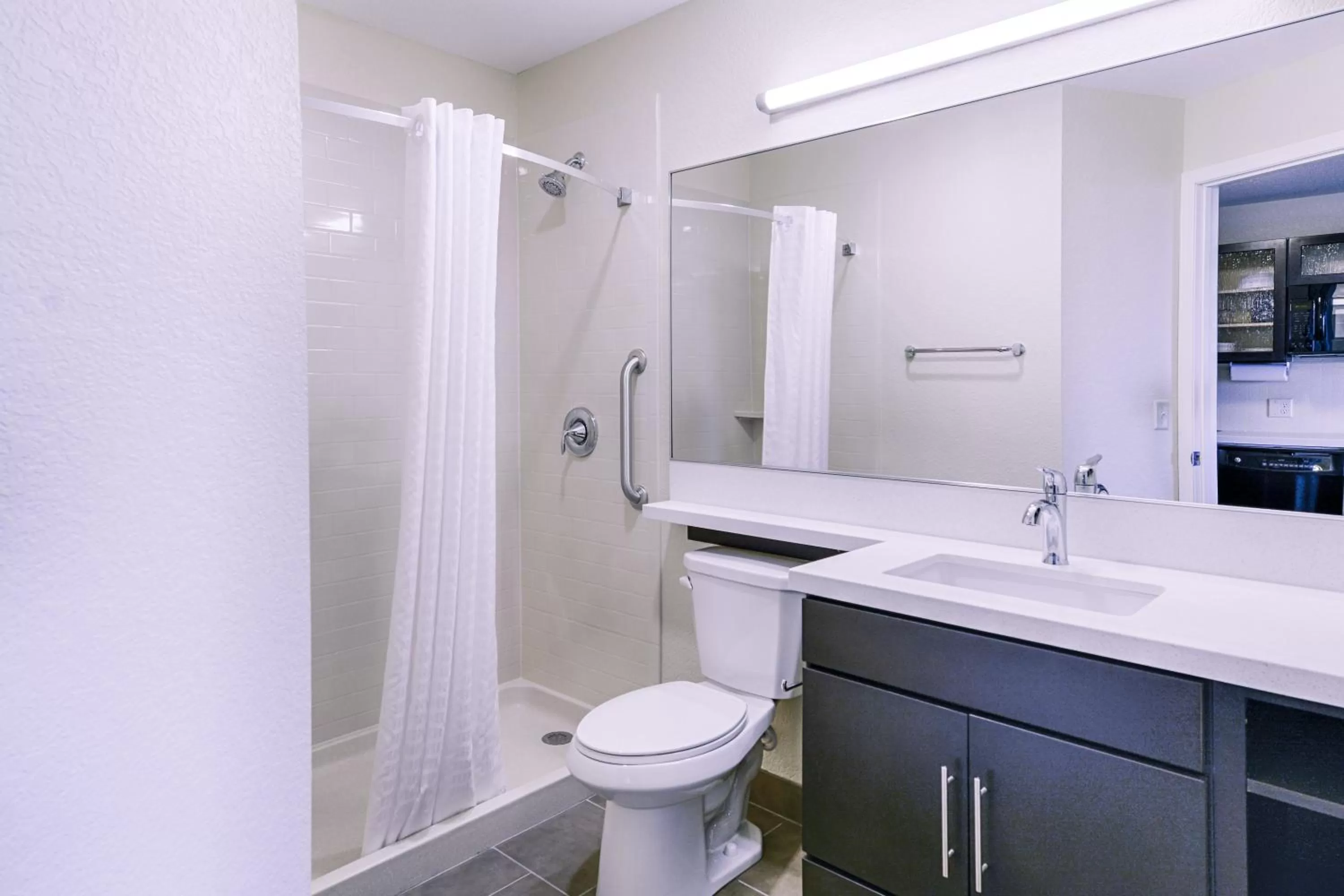 Bathroom in Candlewood Suites Lakeville I-35 by IHG