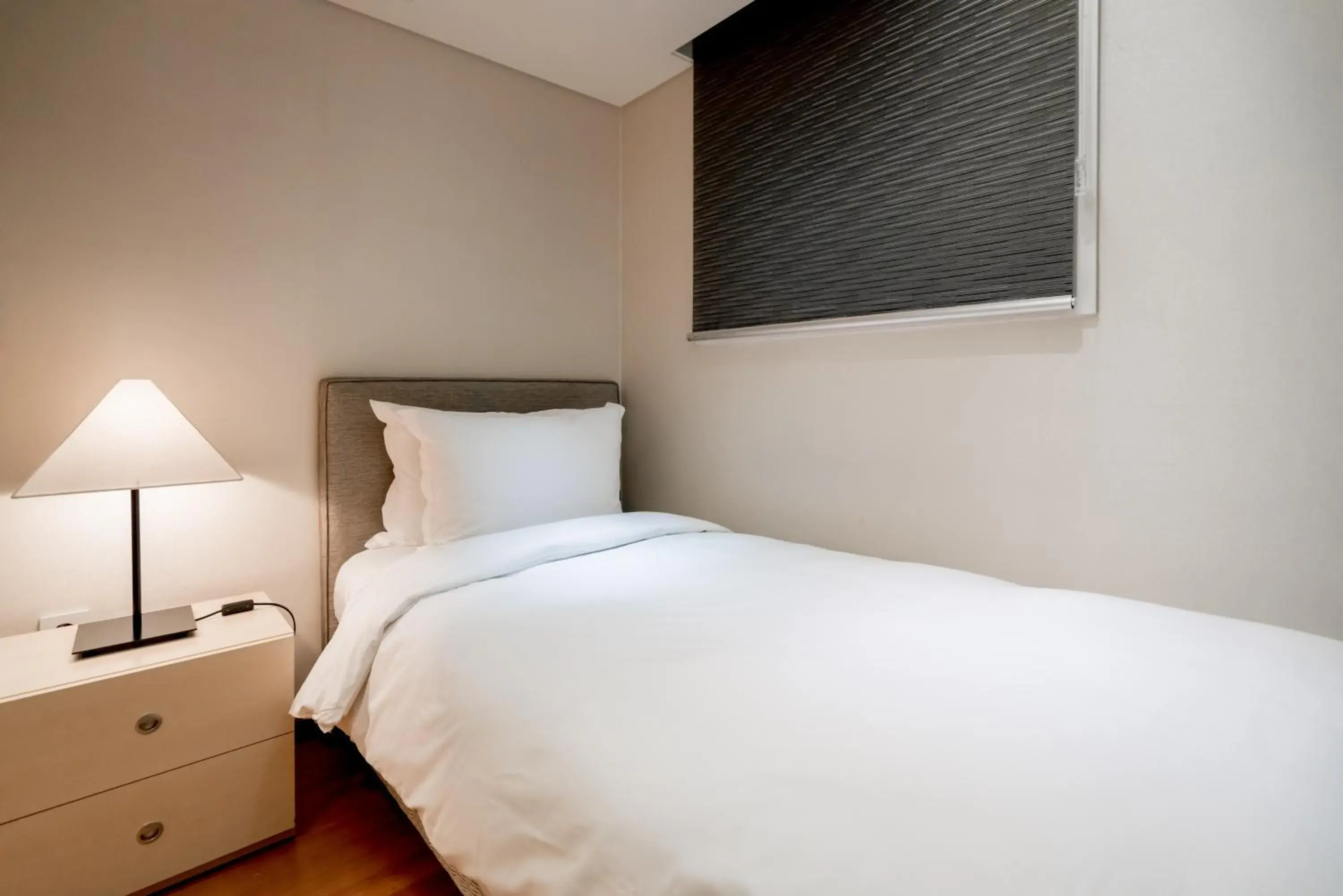 Bed in Oriens Hotel & Residences Myeongdong