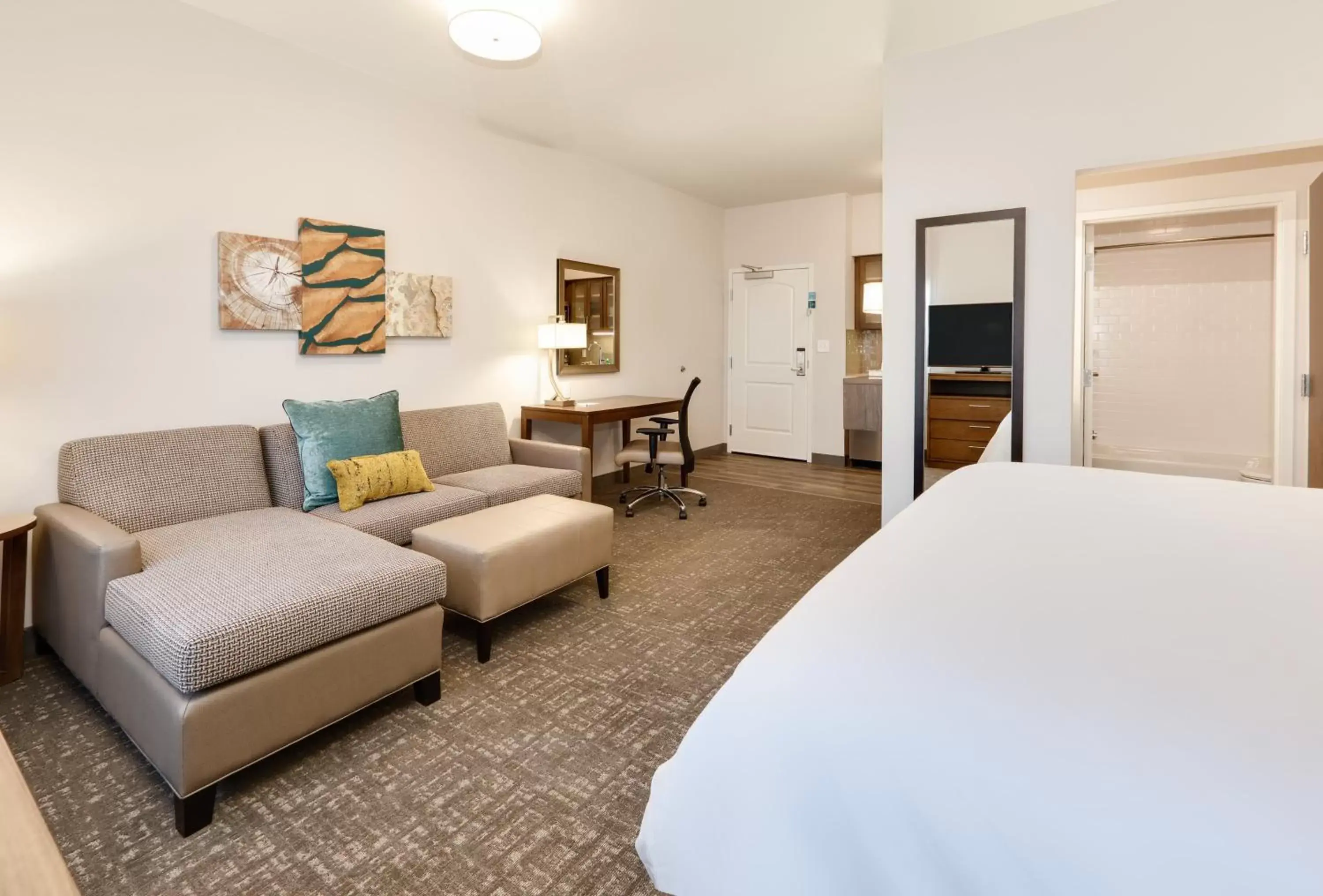 Bedroom, Seating Area in Staybridge Suites - Oklahoma City - Downtown, an IHG Hotel